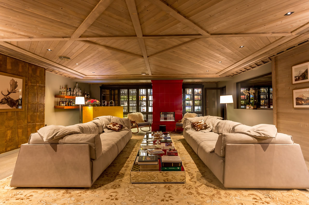 Spacious and comfortable living room with fireplace in Chalet La Datcha in Val Thorens