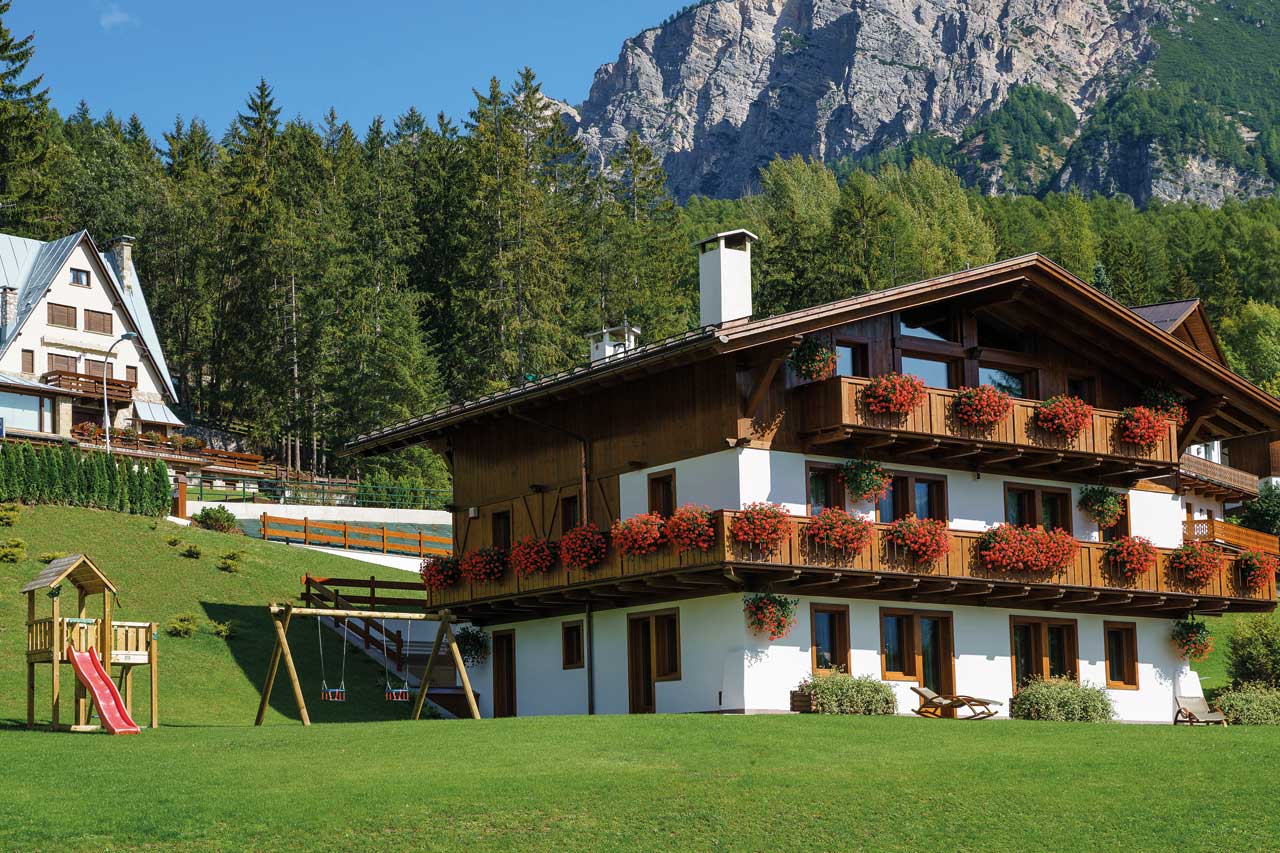 Summer exterior view of Chalet LV01 in Cortina