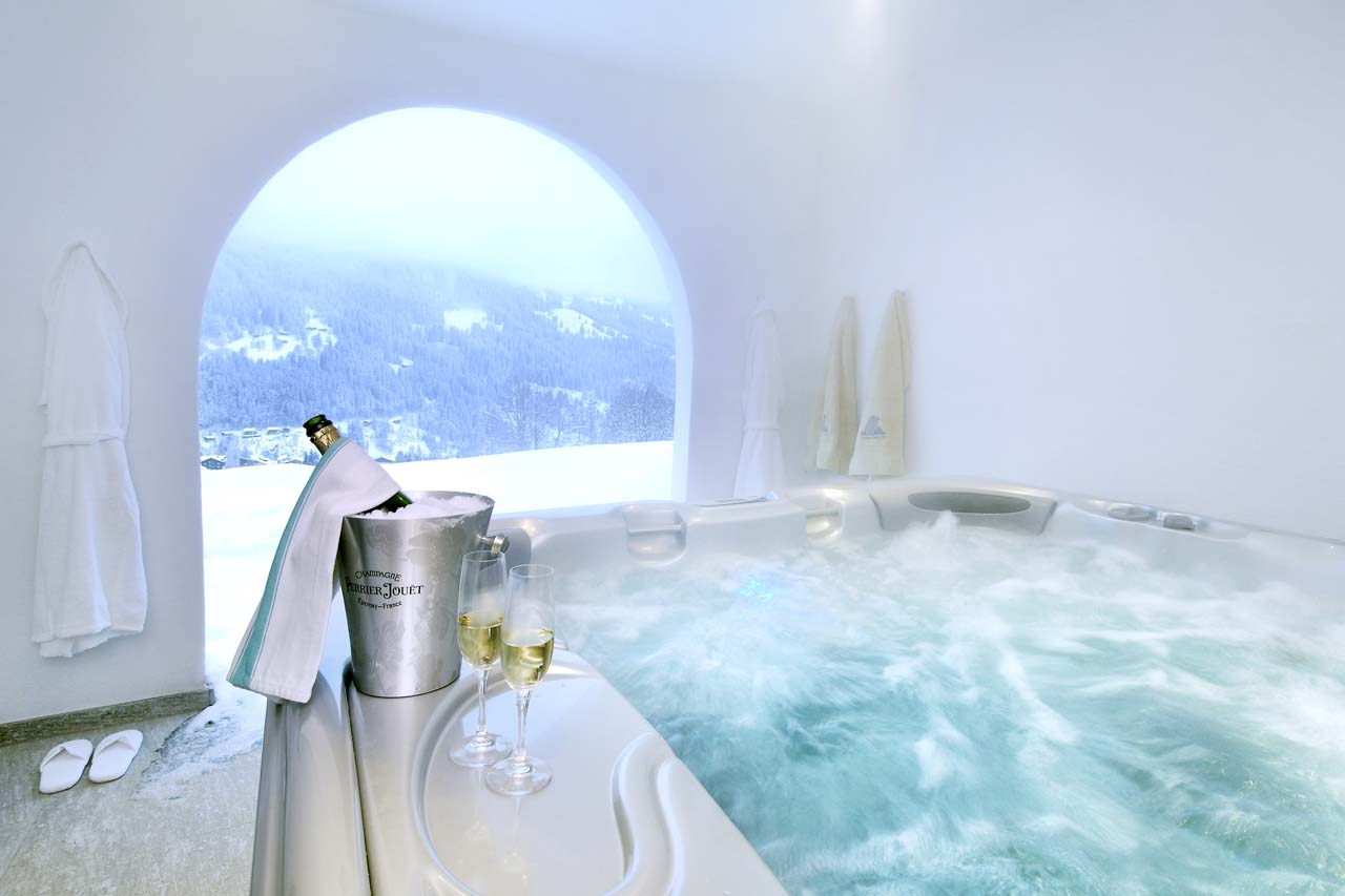 Covered outdoor hot tub at Chesa Falcun in Klosters
