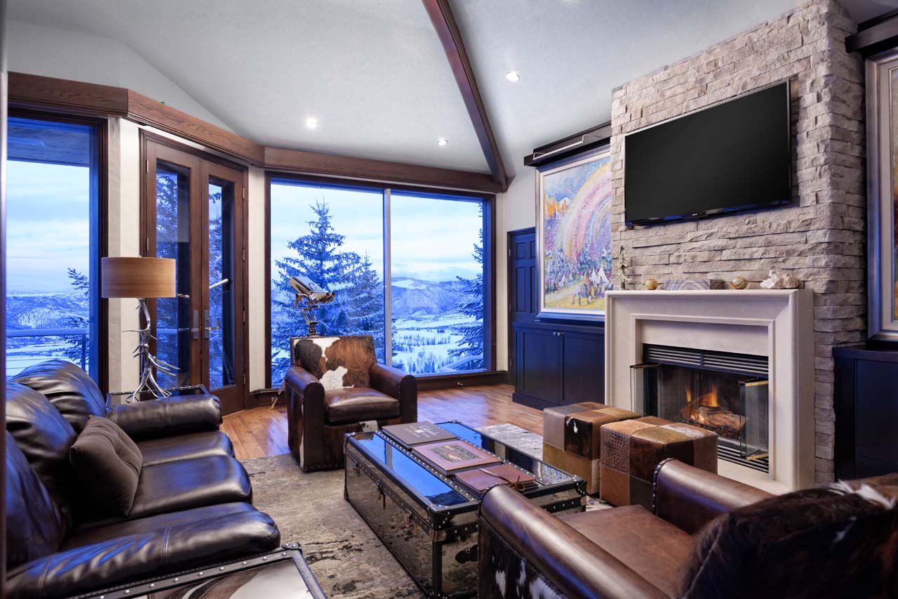 TV & fireplace in living area of Four Peaks Estate in Aspen