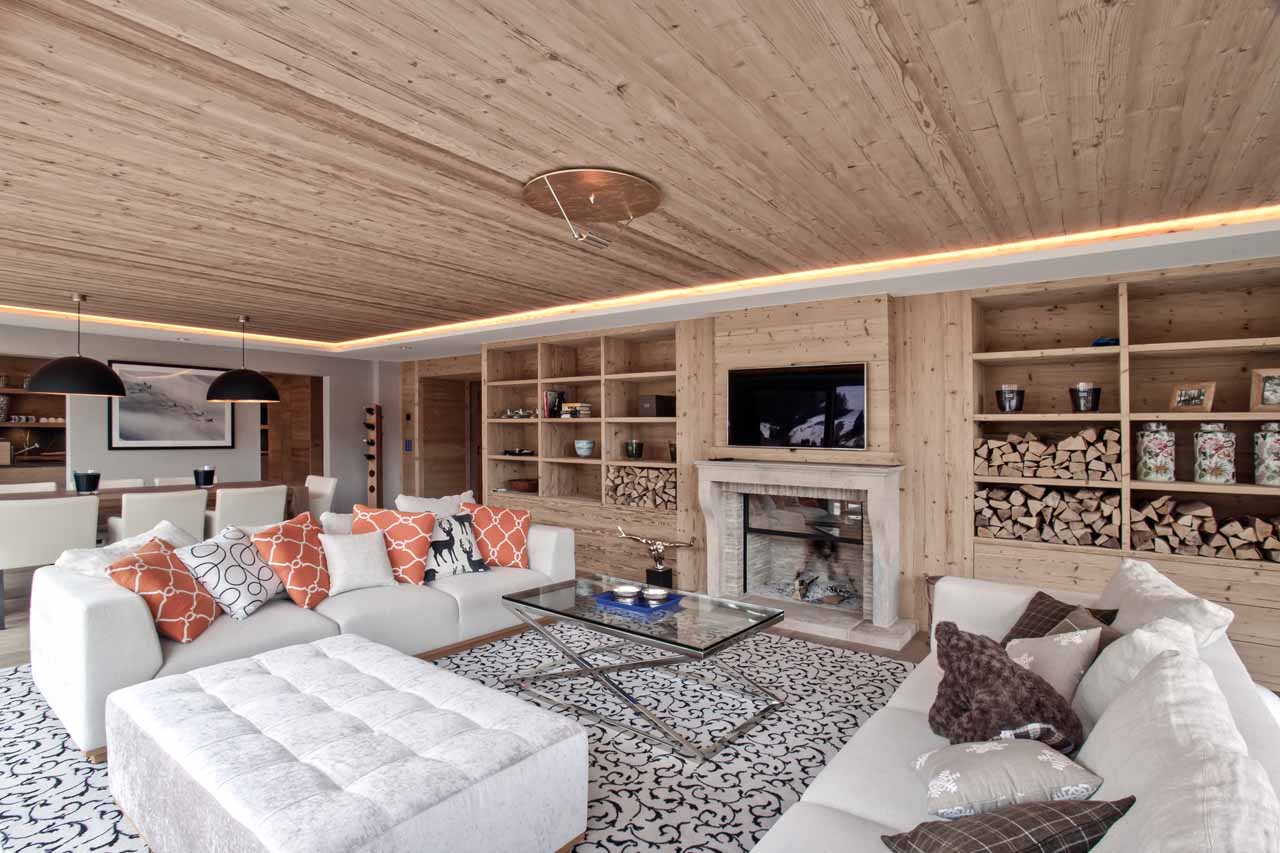 Fireplace and TV in living room at Apartment Le Cerf Rouge in Rougemont