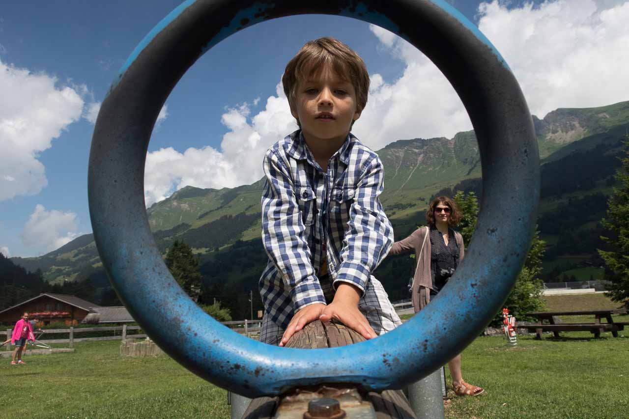 Child playing in Villars sur Ollon in summer