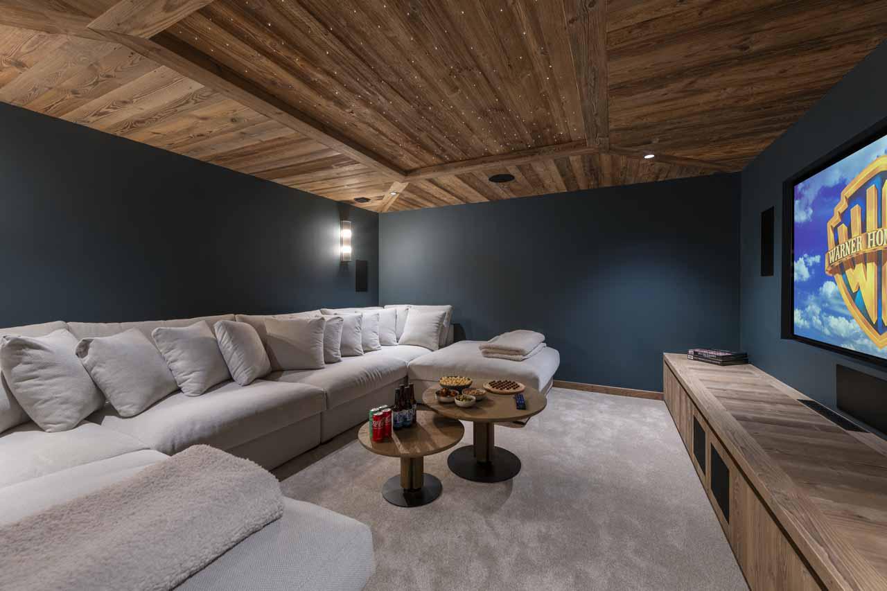 Cinema room with wrap-around sofa in Chalet Fika, Les Gets