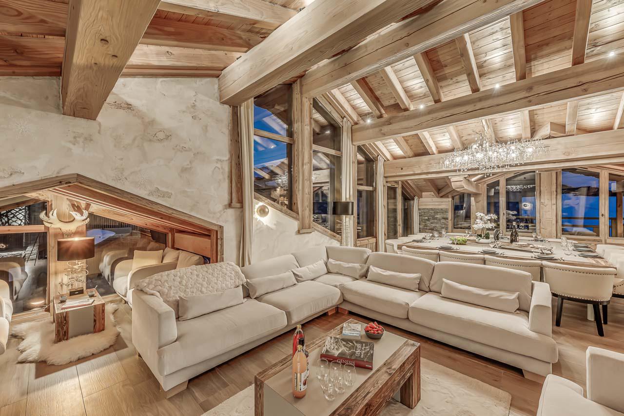 Open living space with adjoining dining area at Chalet Ganga in Tignes
