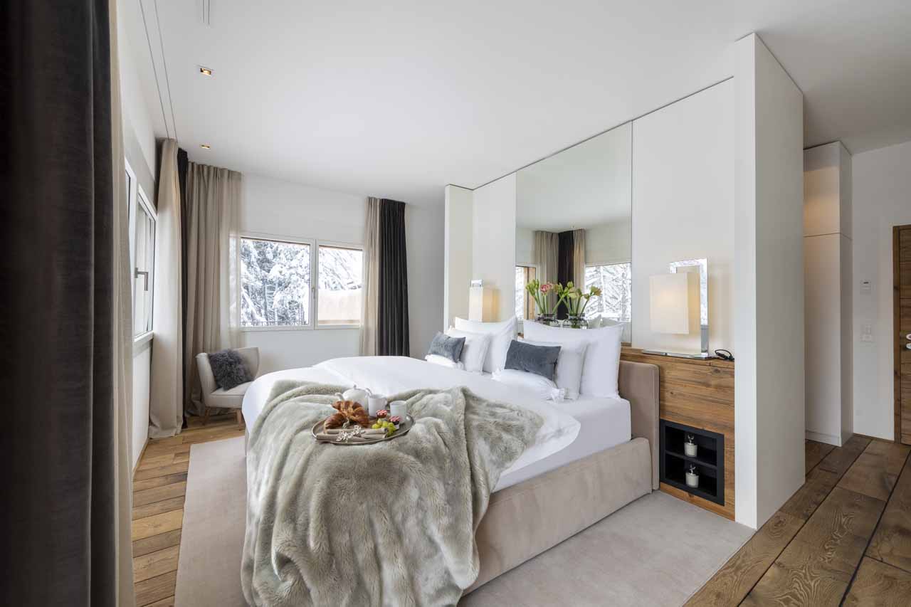 Bedroom one at Chalet Jakobshorn in DavosJulia
