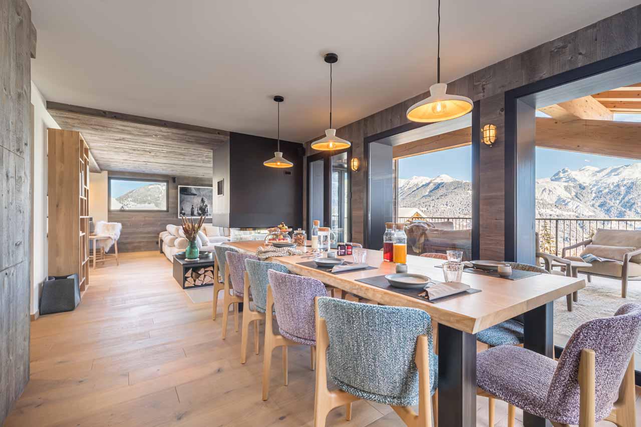 Spacious dining table accommodating up to 12 guests at Chalet Kandahar in Courchevel 1550
