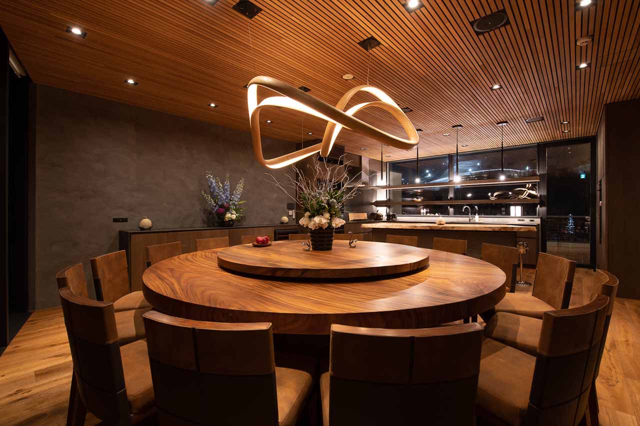 Dining room and kitchen at HakuVillas Penthouse in Niseko
