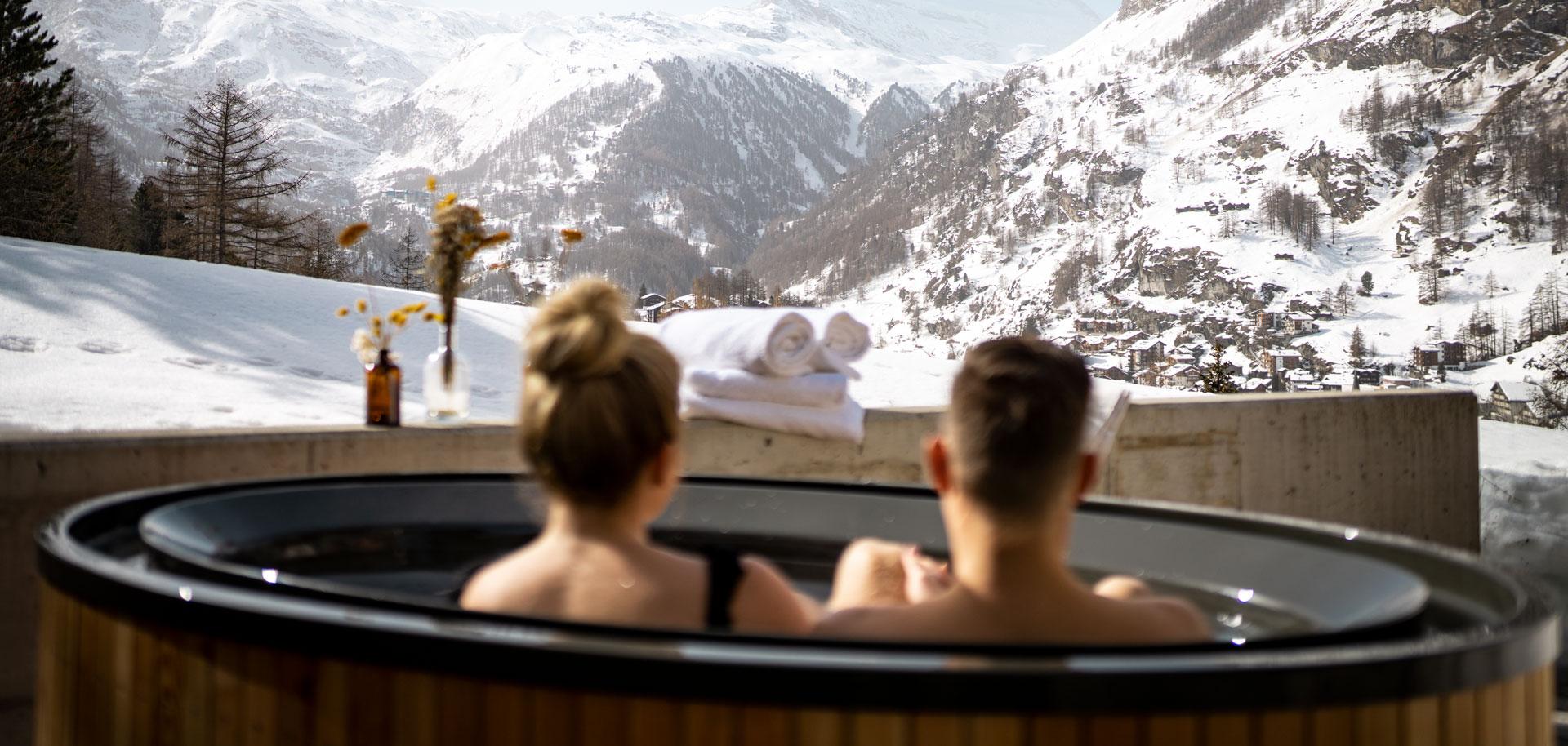 Relaxing in outdoor hot tub in Cervo Mountain Resort in Zermatt