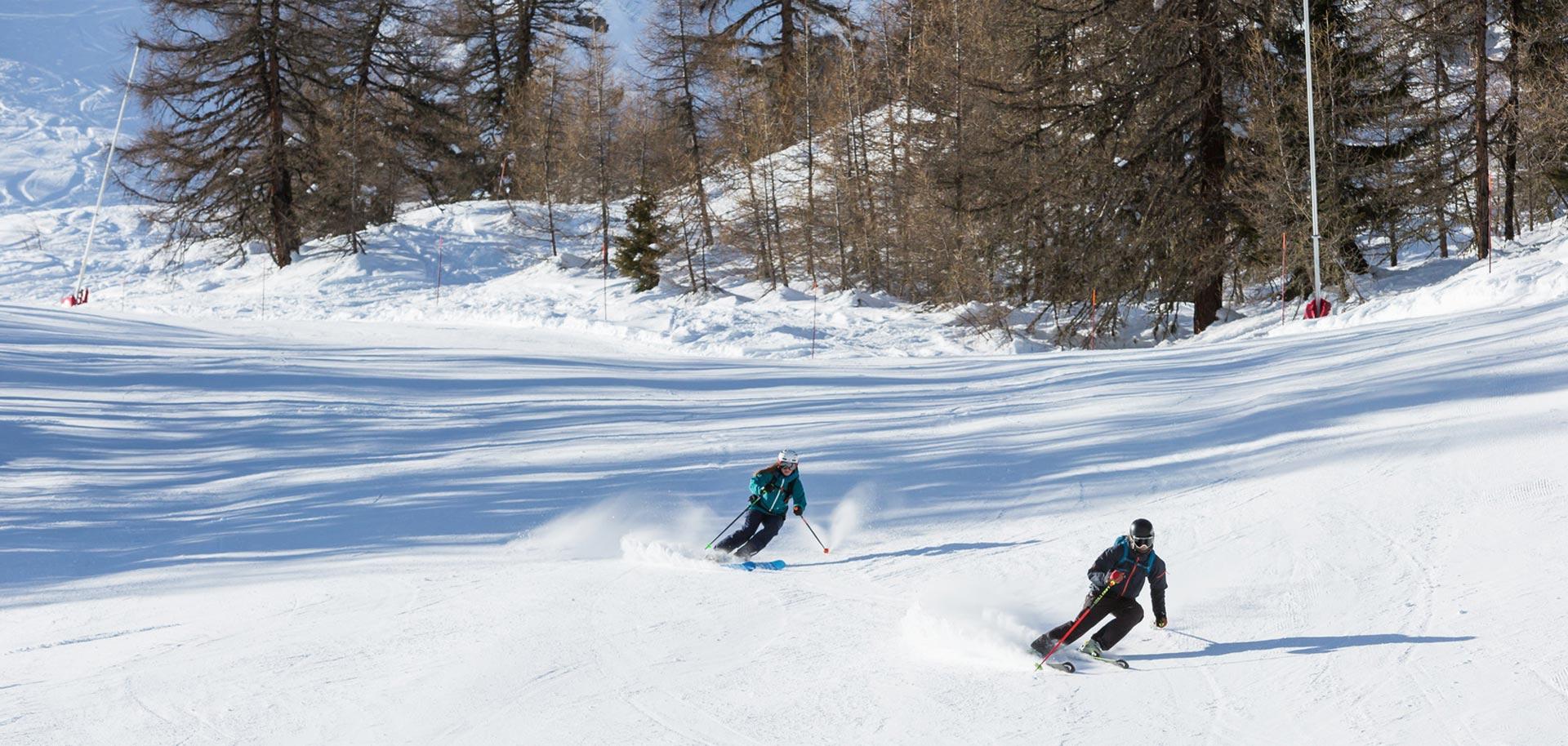Couple skiing in Verbier
