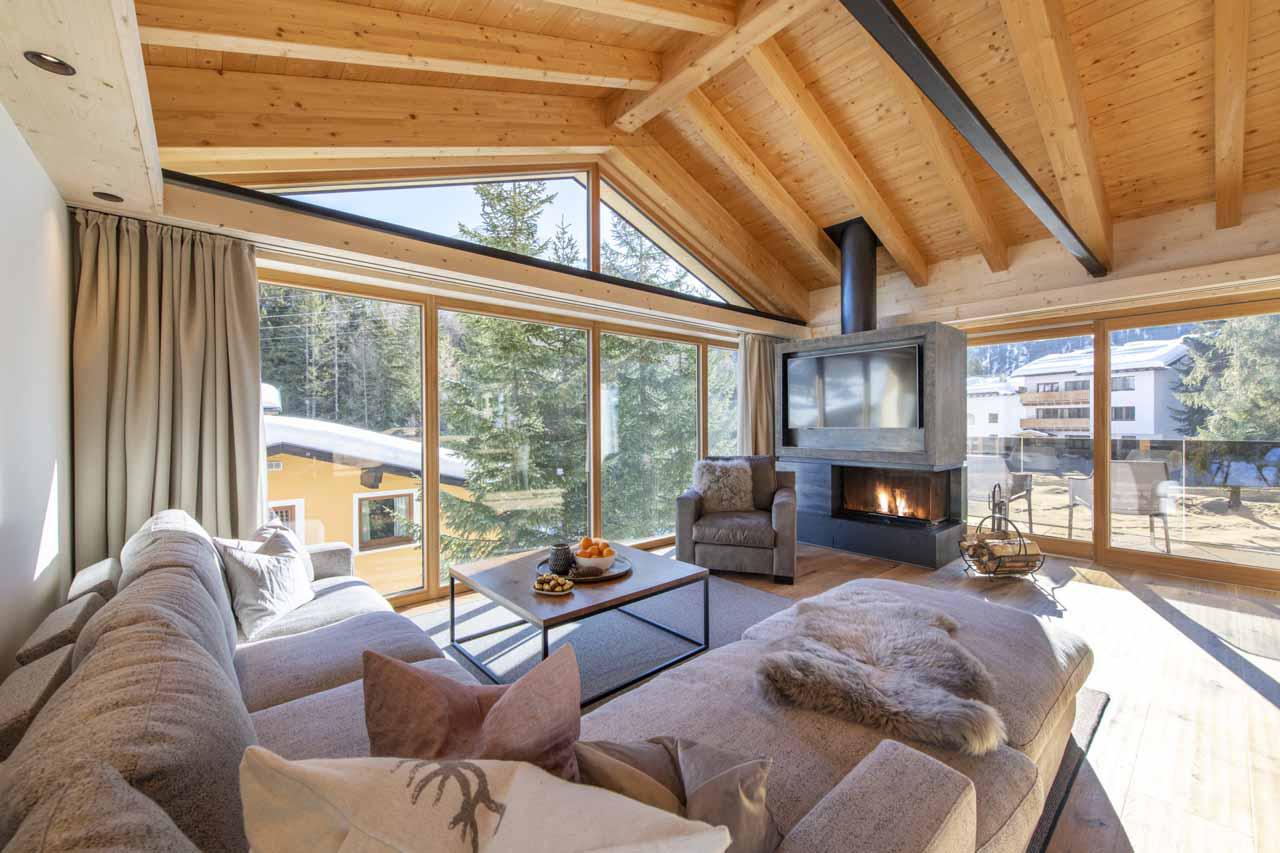 Wood fireplace in living room of Villa Villekulla in St Anton