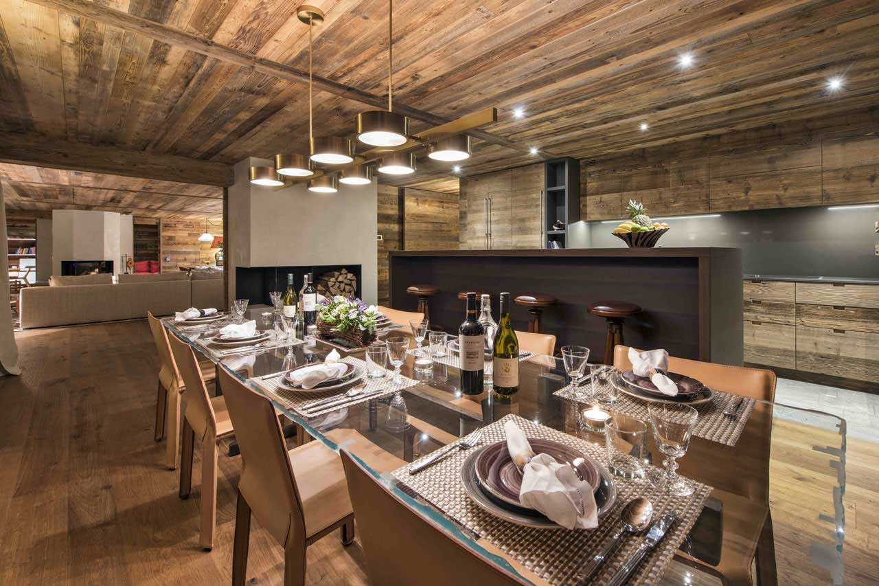 Dining area and kitchen at  Place Blanche in Verbier