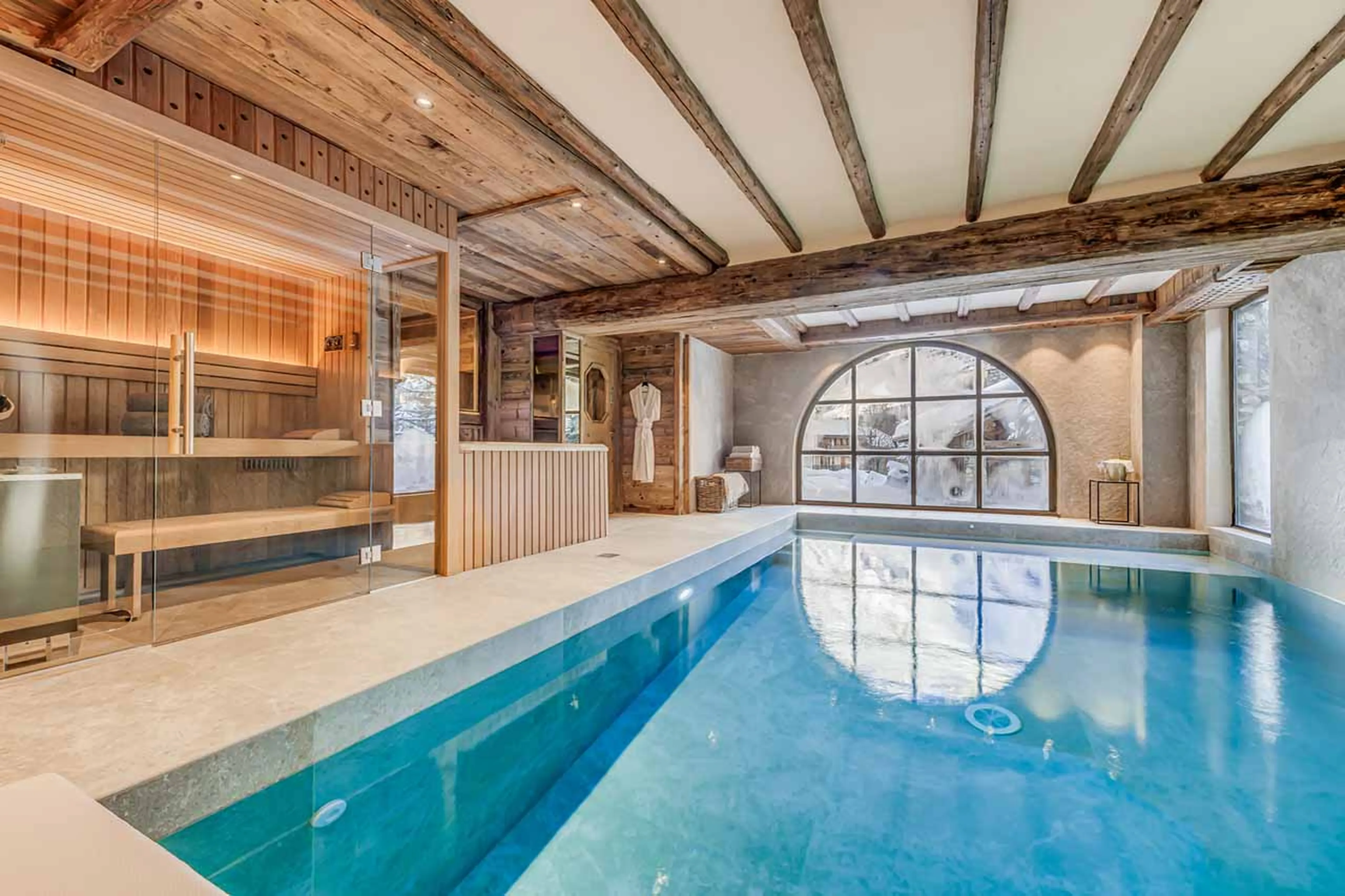 Indoor swimming pool with jet stream in Chalet Le Rocher in Val d’Isere