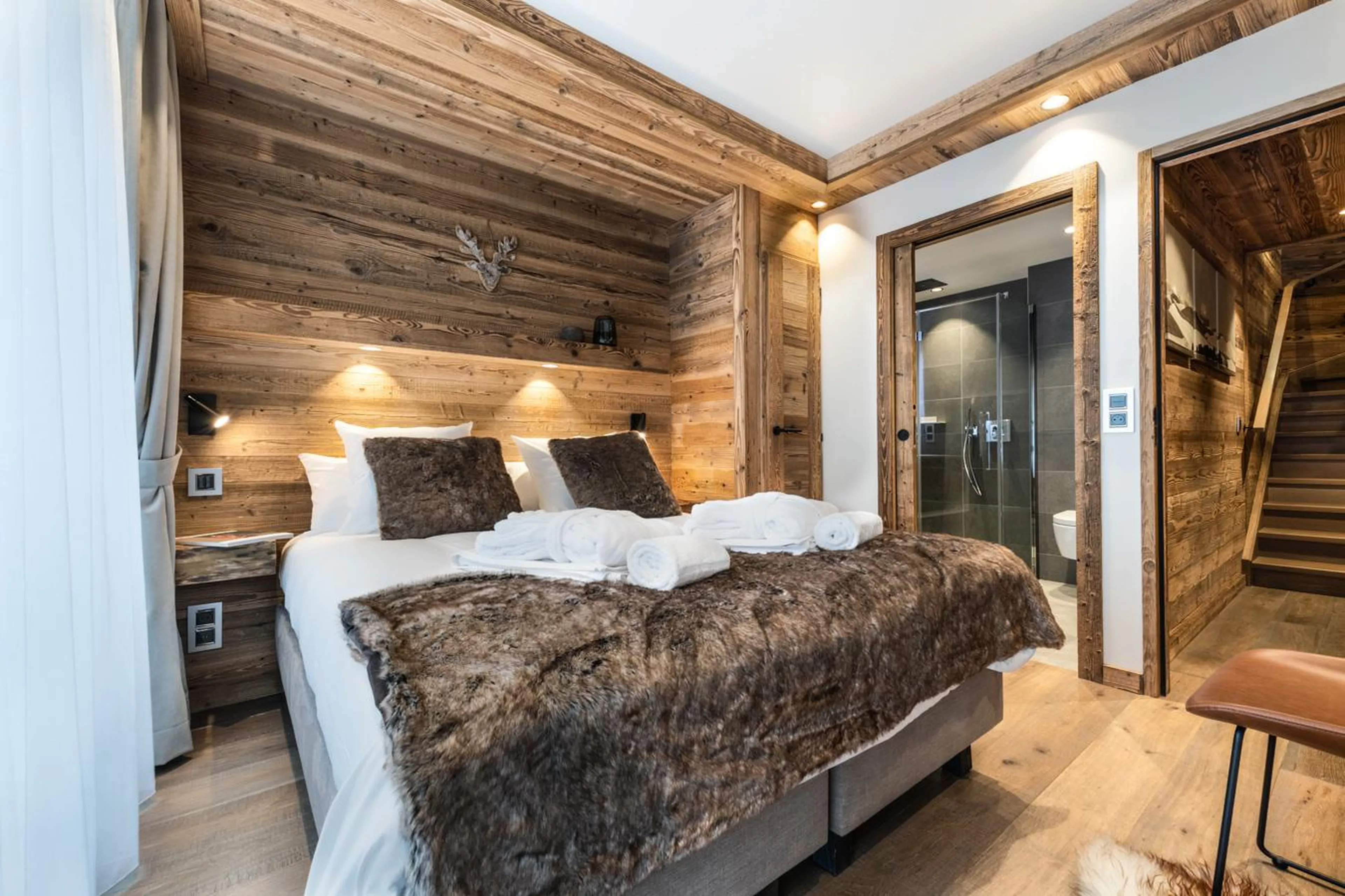 Double bedroom with terrace access and en-suite shower room in Alaska Lodge 5, Val d'Isere
