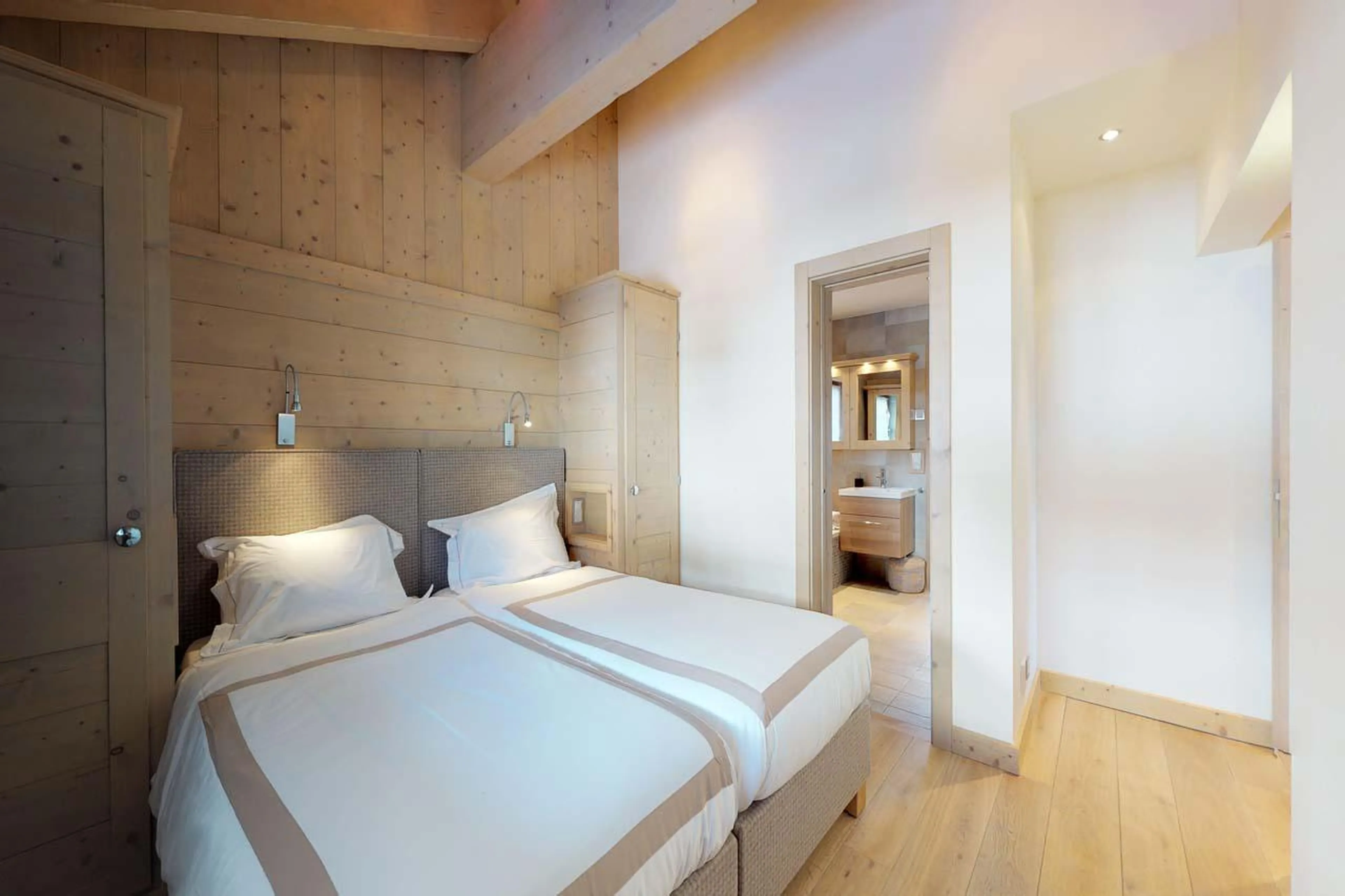 Bright double bedroom with wood-beam ceiling at Chalet Albert-Luc in Verbier
