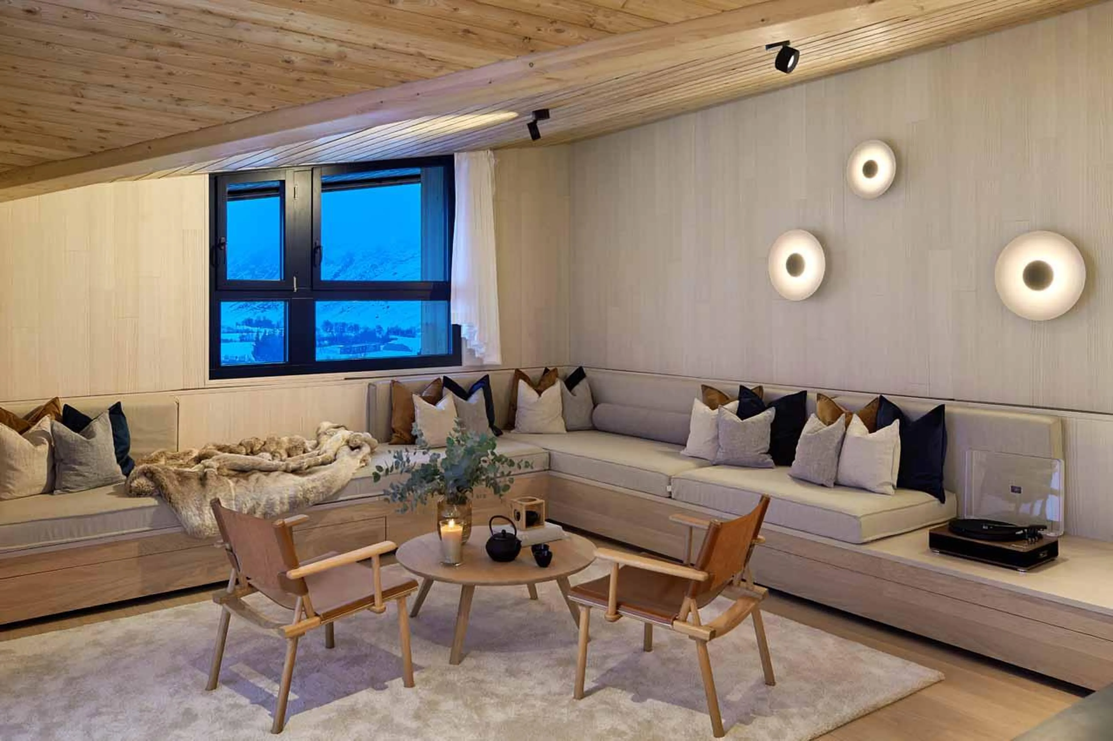 Wrap-around sofa and coffee table in Andermatt Alpine Premium 2, Andermatt