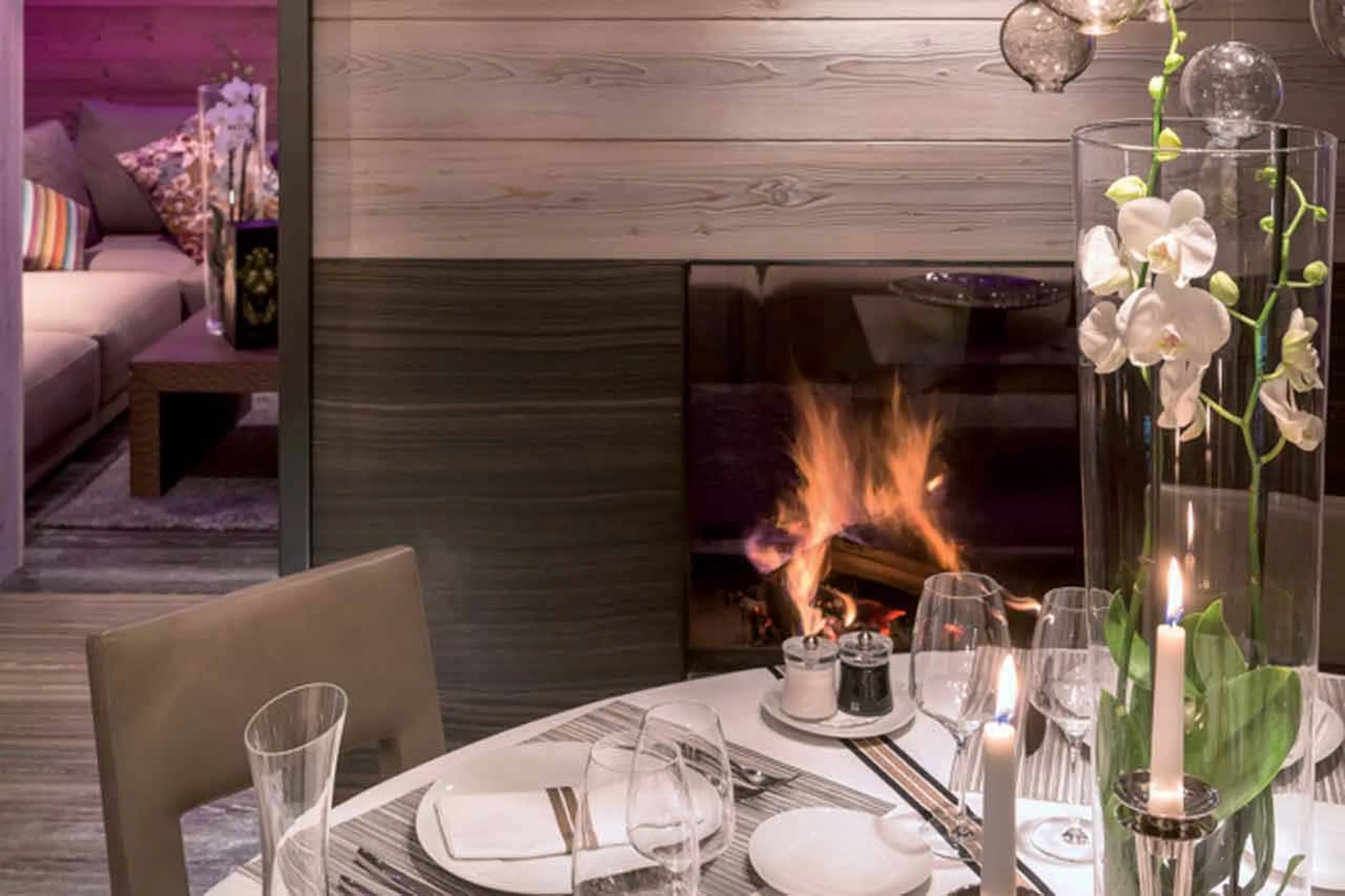 Fireplace and dining area at Apartment Amethyst in Courchevel 1850