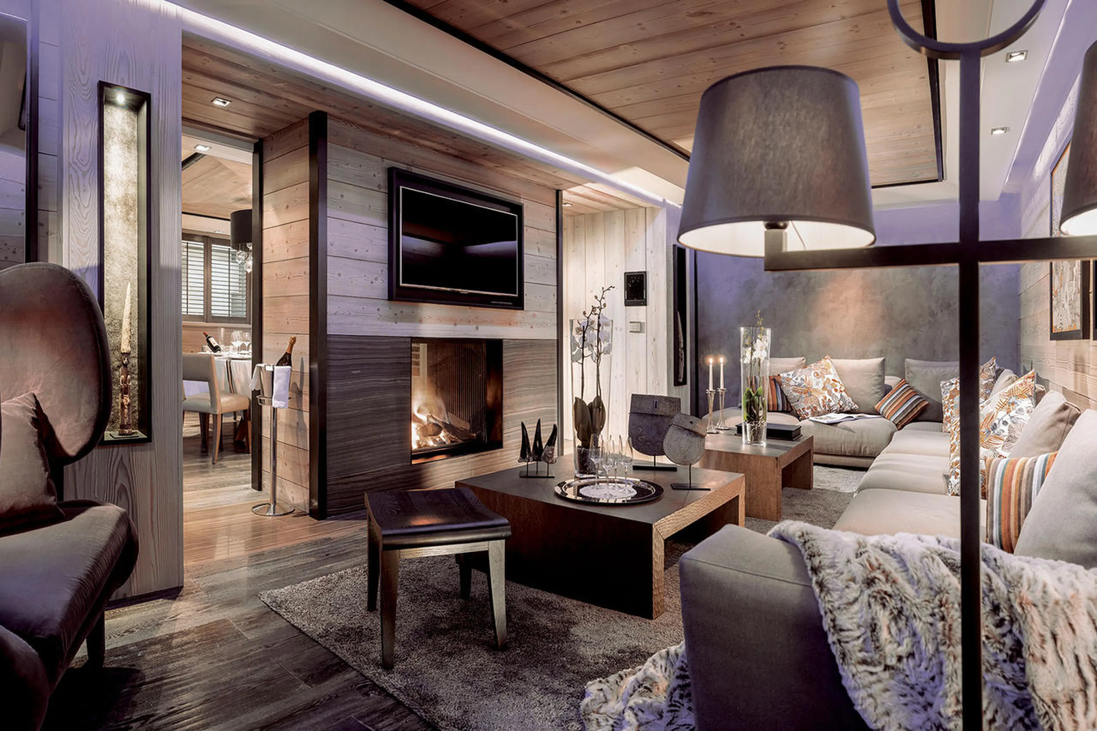 Open plan south-facing living room with fireplace in Apartment Amethyst in Courchevel 1850