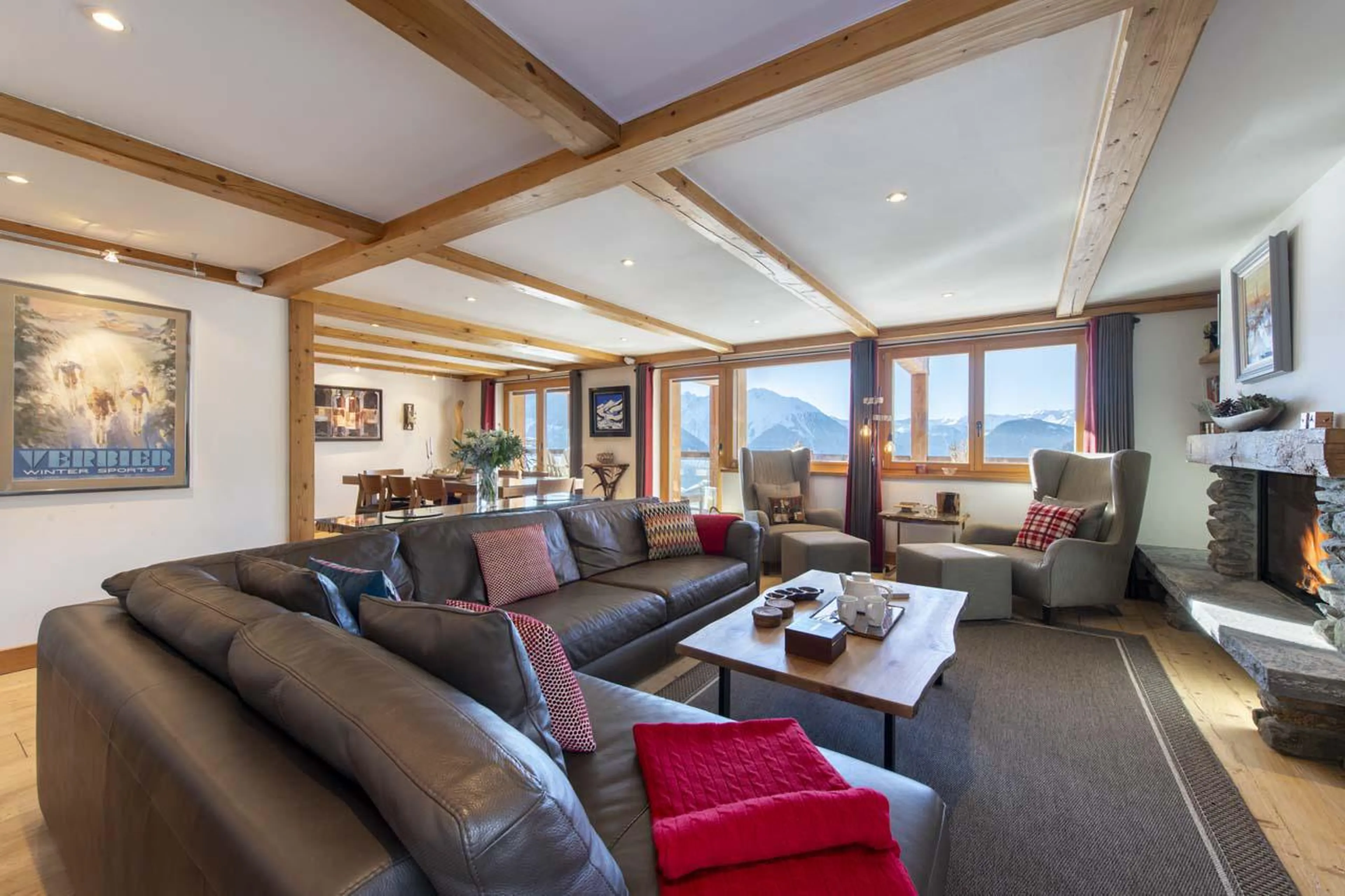 The sofa area lies adjacent to the dining space  at Apartment Basalte in Verbier