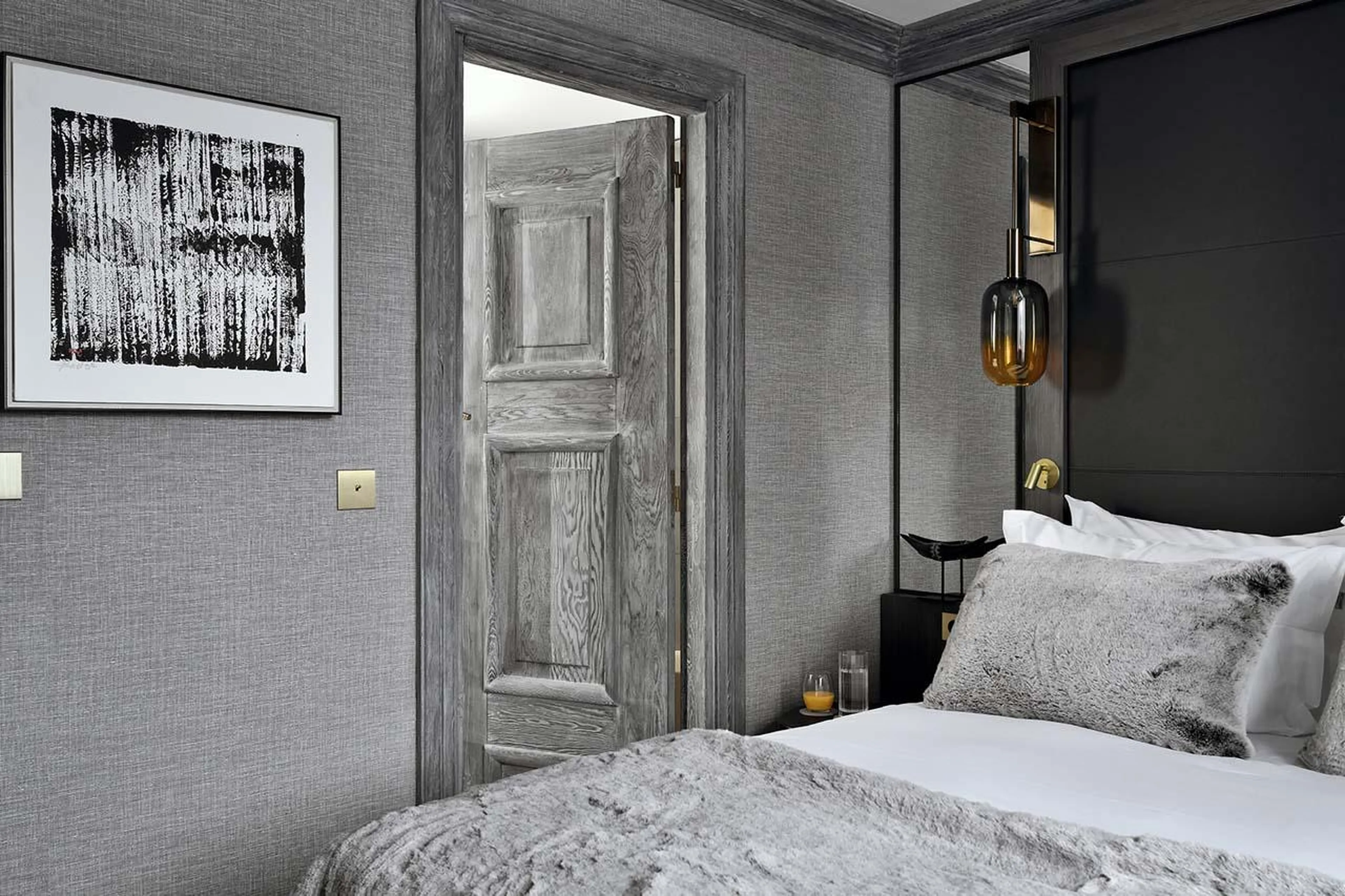 Modern double bedroom with contemporary artwork at Apartment Belvedere in Courchevel 1850