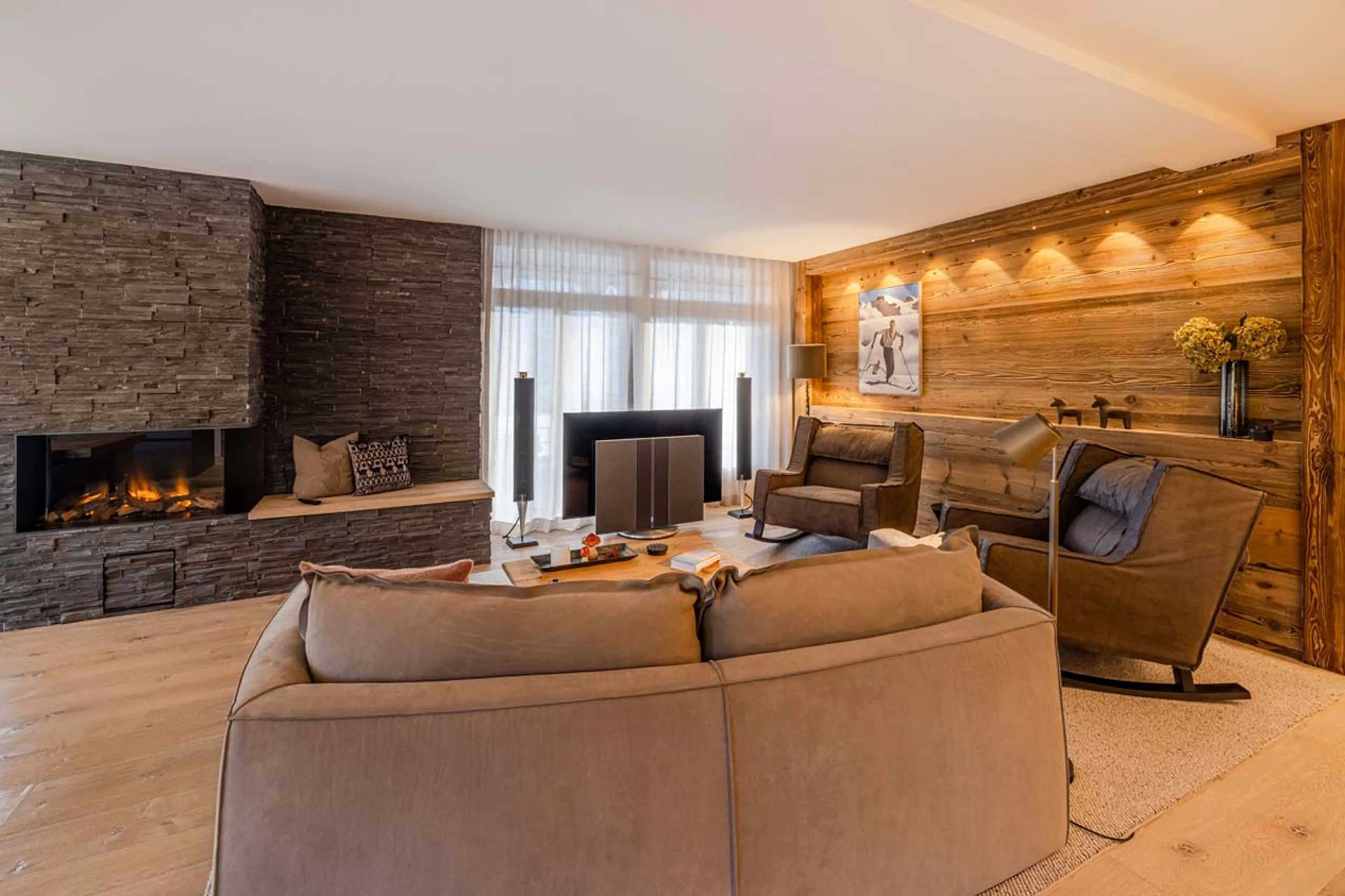 Living area with fireplace at Apartment Mountain Dream in Davos