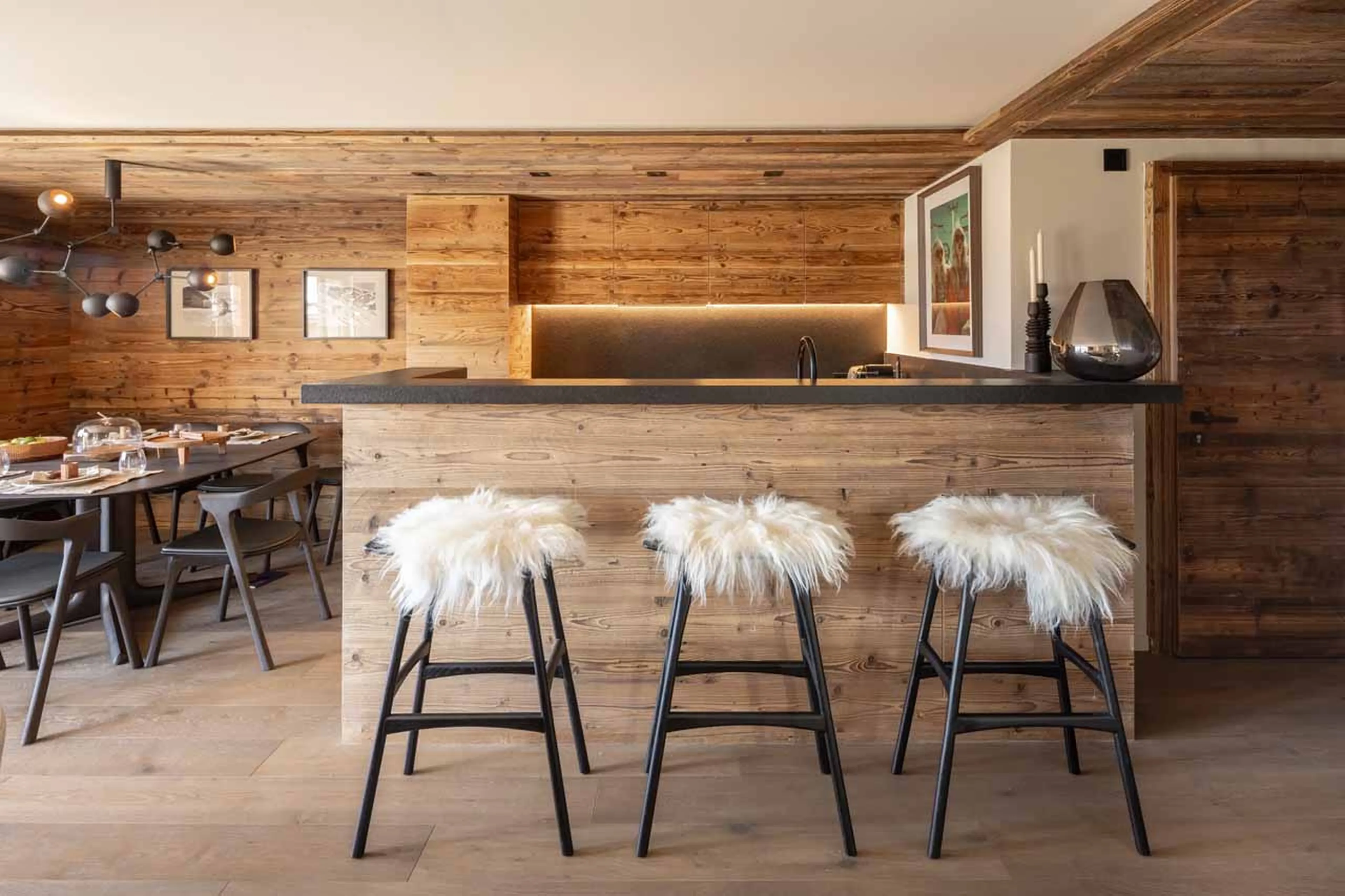 Kitchen with bar seating at Apartment Corbettaz in Verbier