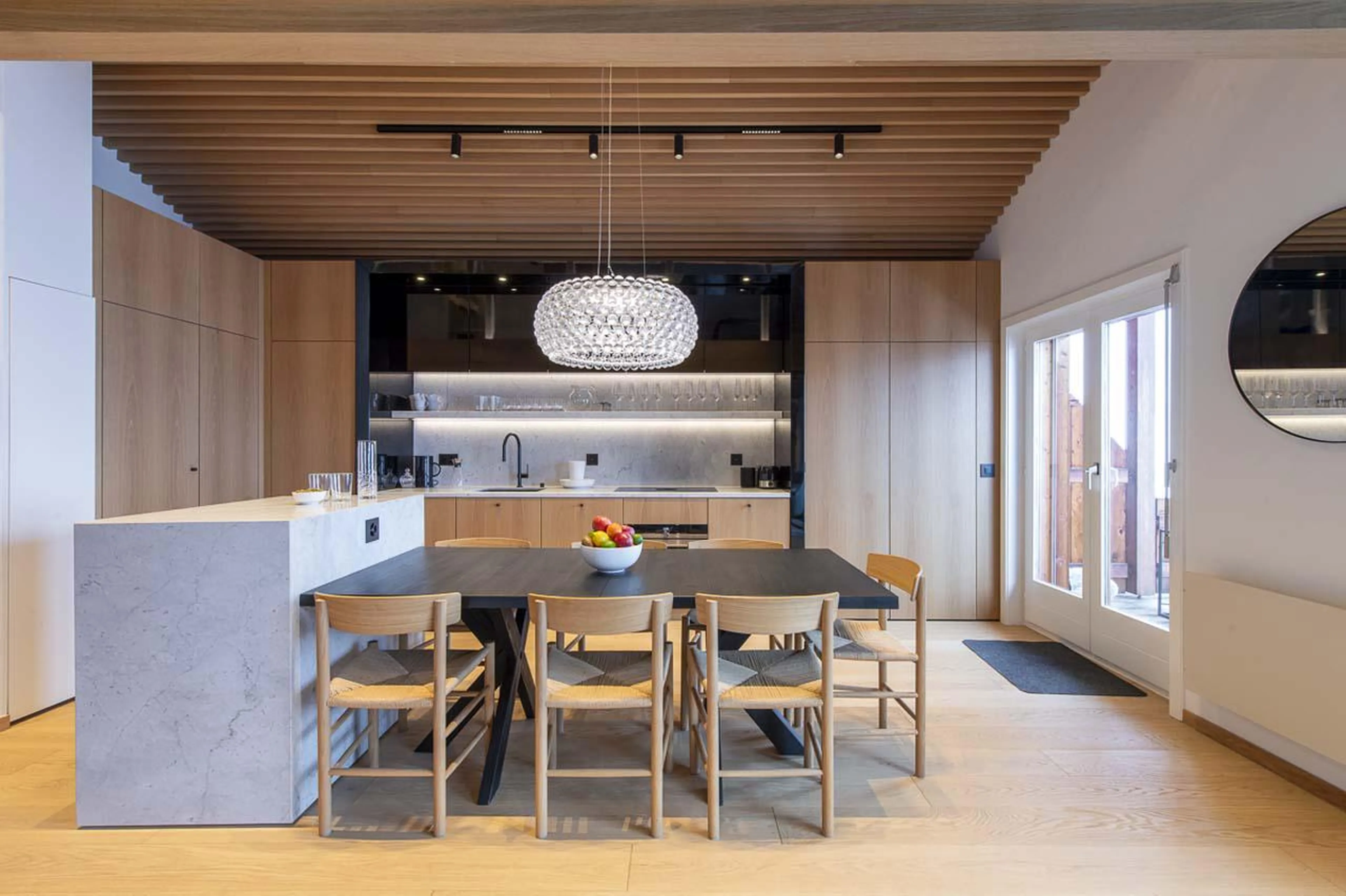 Open kitchen with marble style countertops at Apartment Grignote in Verbier