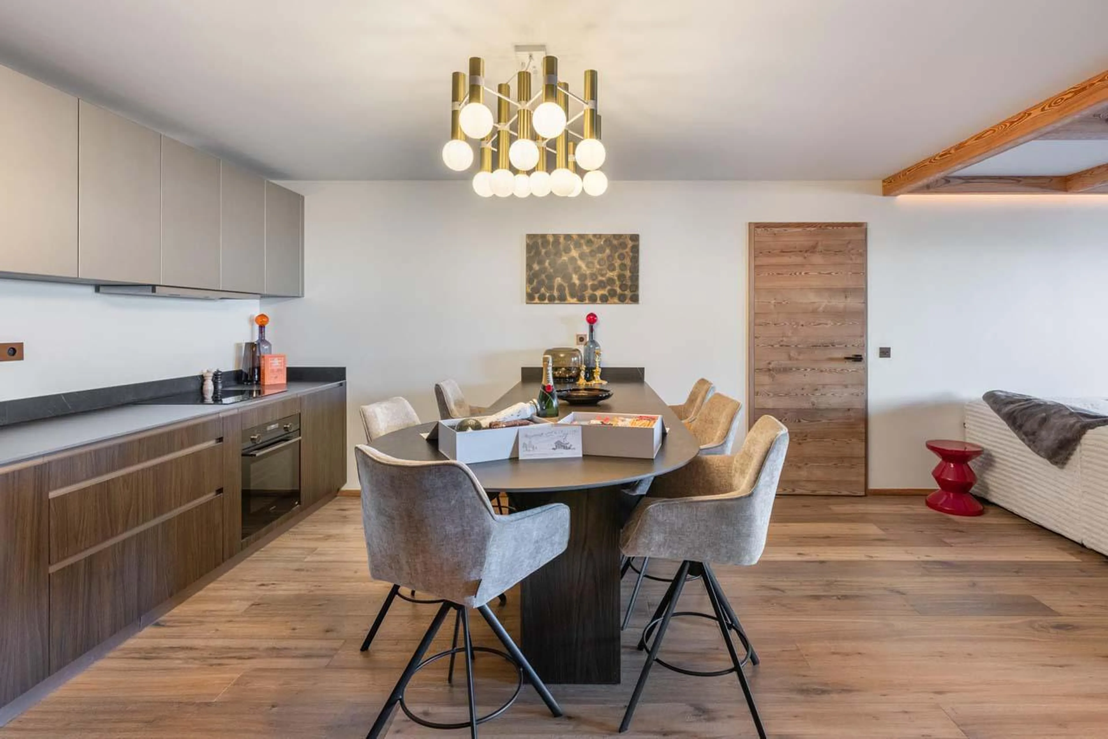 Well-equipped kitchen and modern dining table at Apartment Intresso in Courchevel 1850