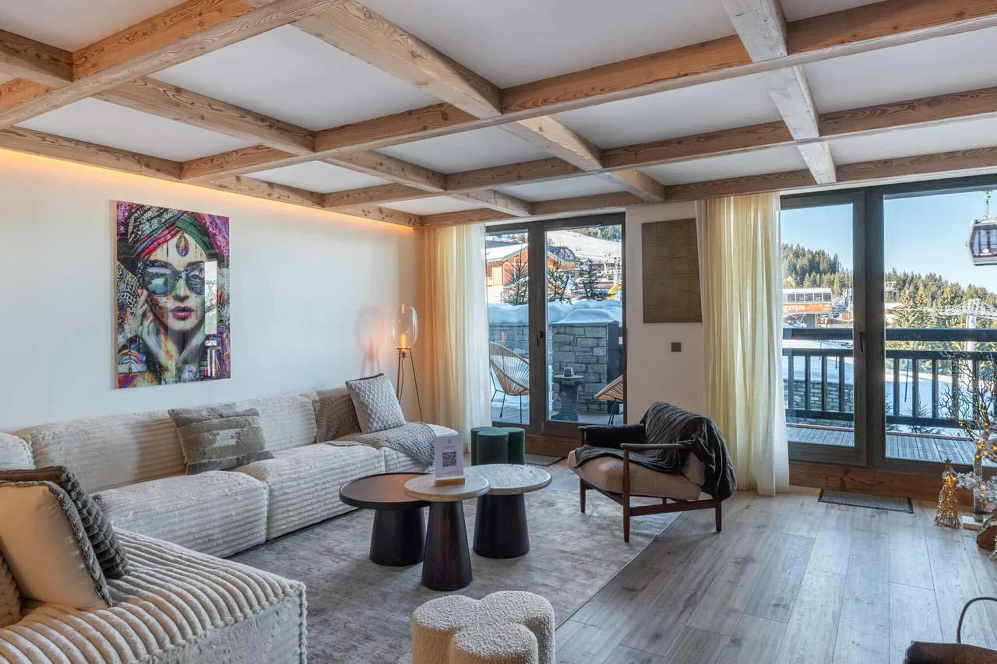 Comfortable sofa area and access to balcony at Apartment Intresso in Courchevel 1850