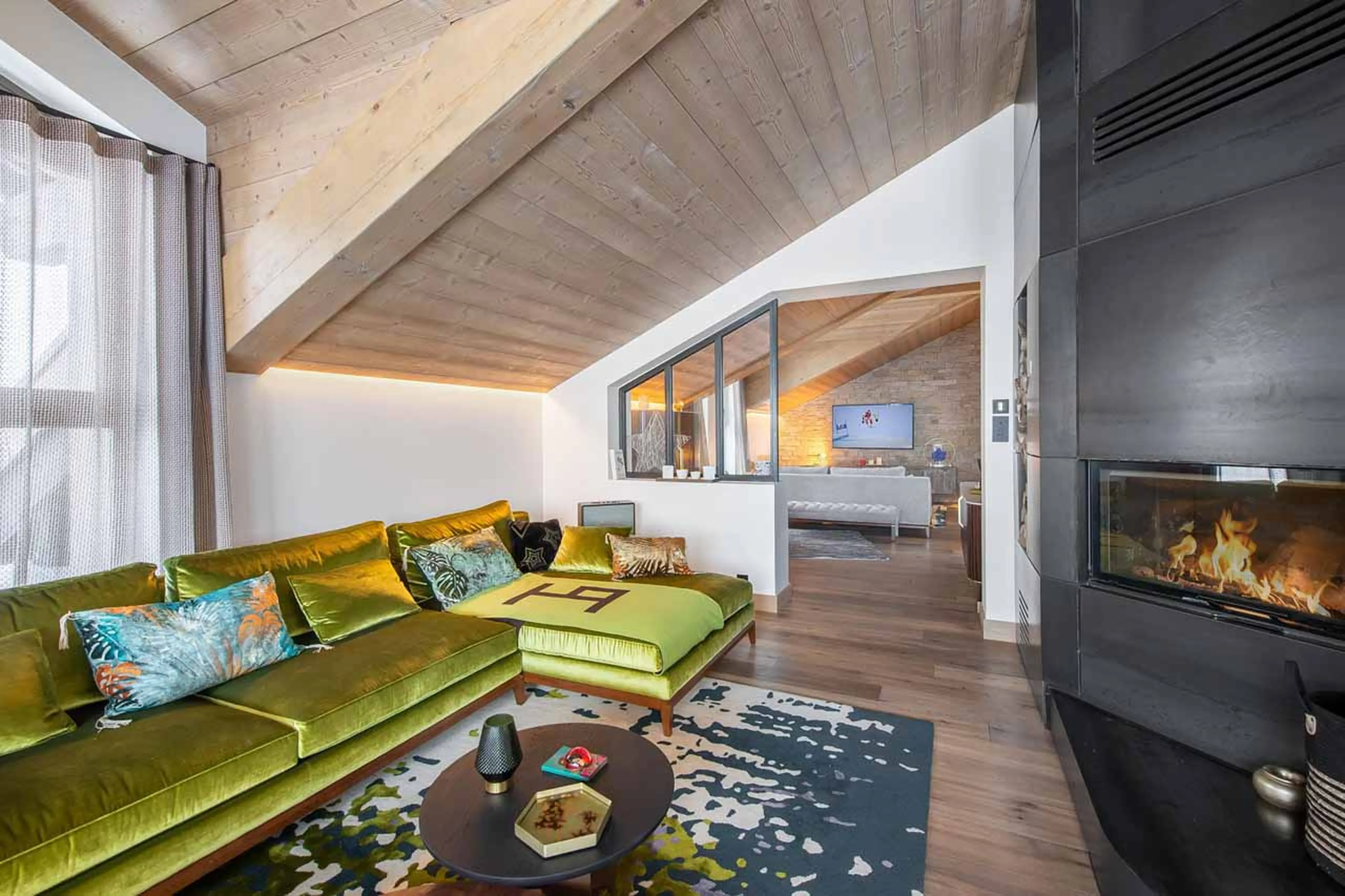Fireplace in living area of Apartment Le Septieme Ciel in Courchevel 1850