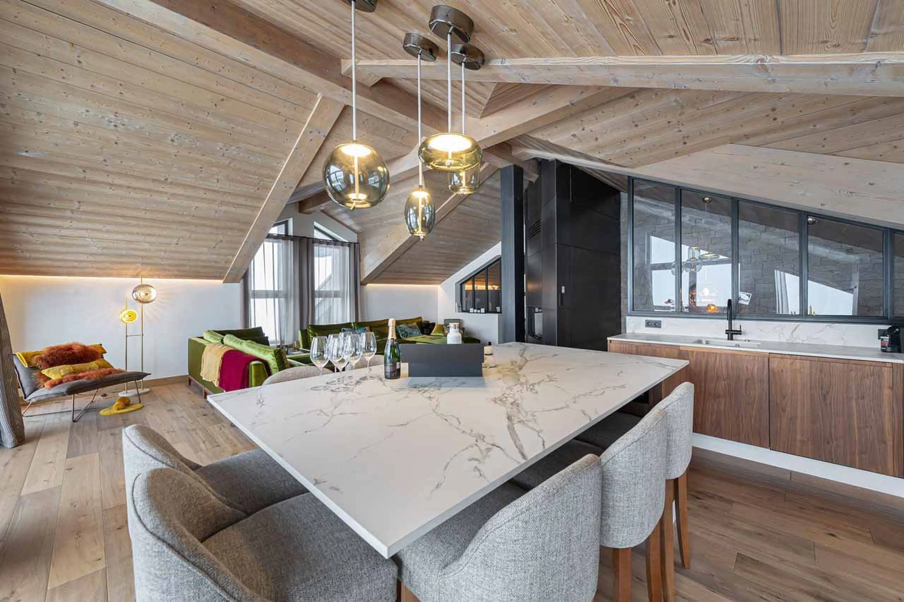 Kitchen with central island at Apartment Le Septieme Ciel in Courchevel 1850