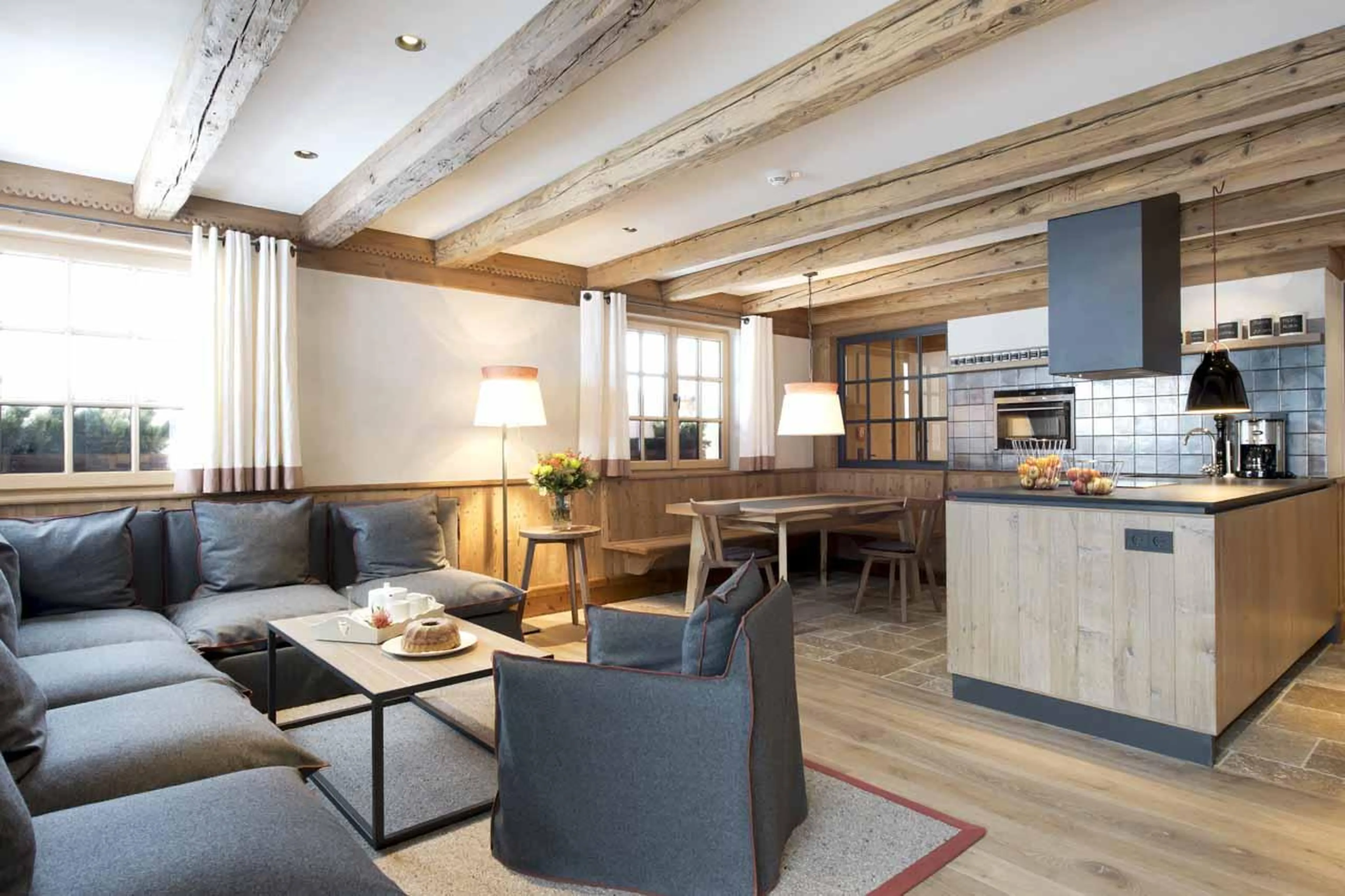 Wrap-around sofa and dining nook in kitchen in Apartment Lech I, Lech