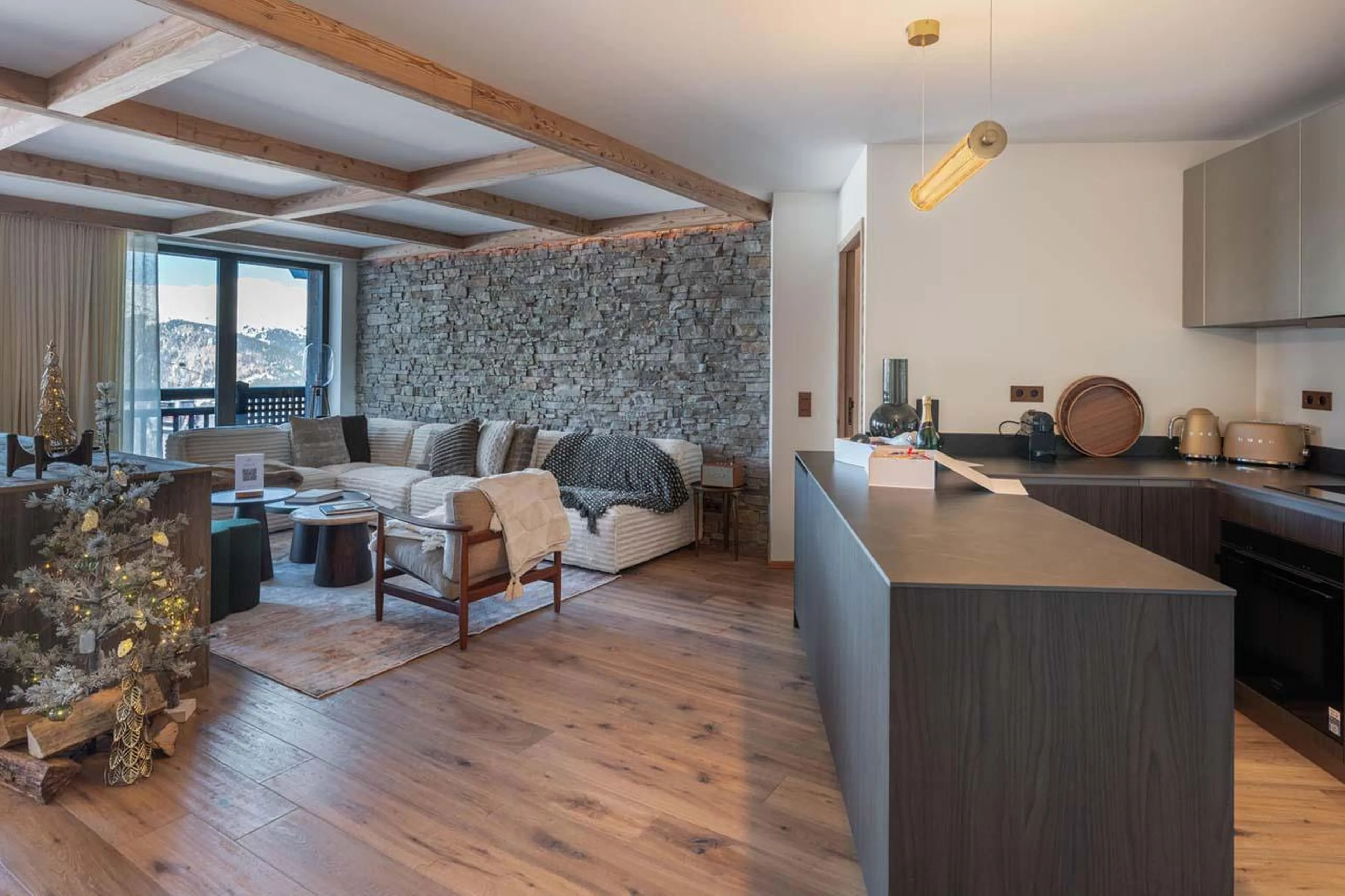 Kitchen overlooking living area at Apartment Limeo in Courchevel 1850