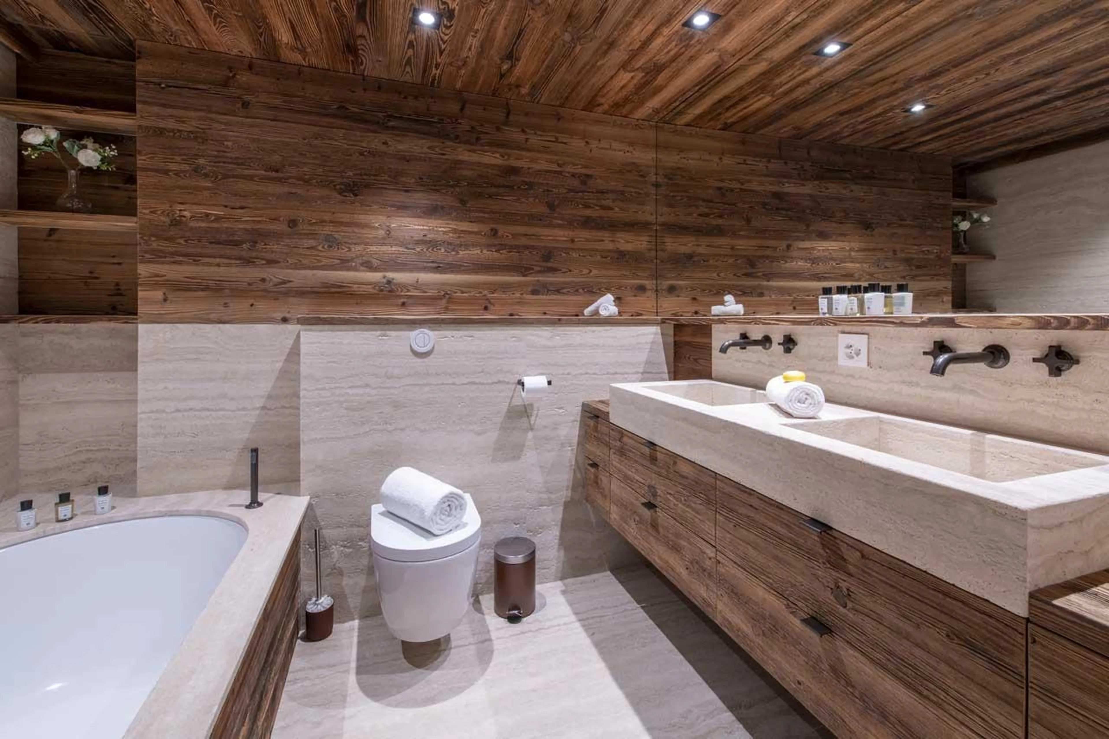 En-suite bathroom with double basin at Apartment Lussy in Verbier