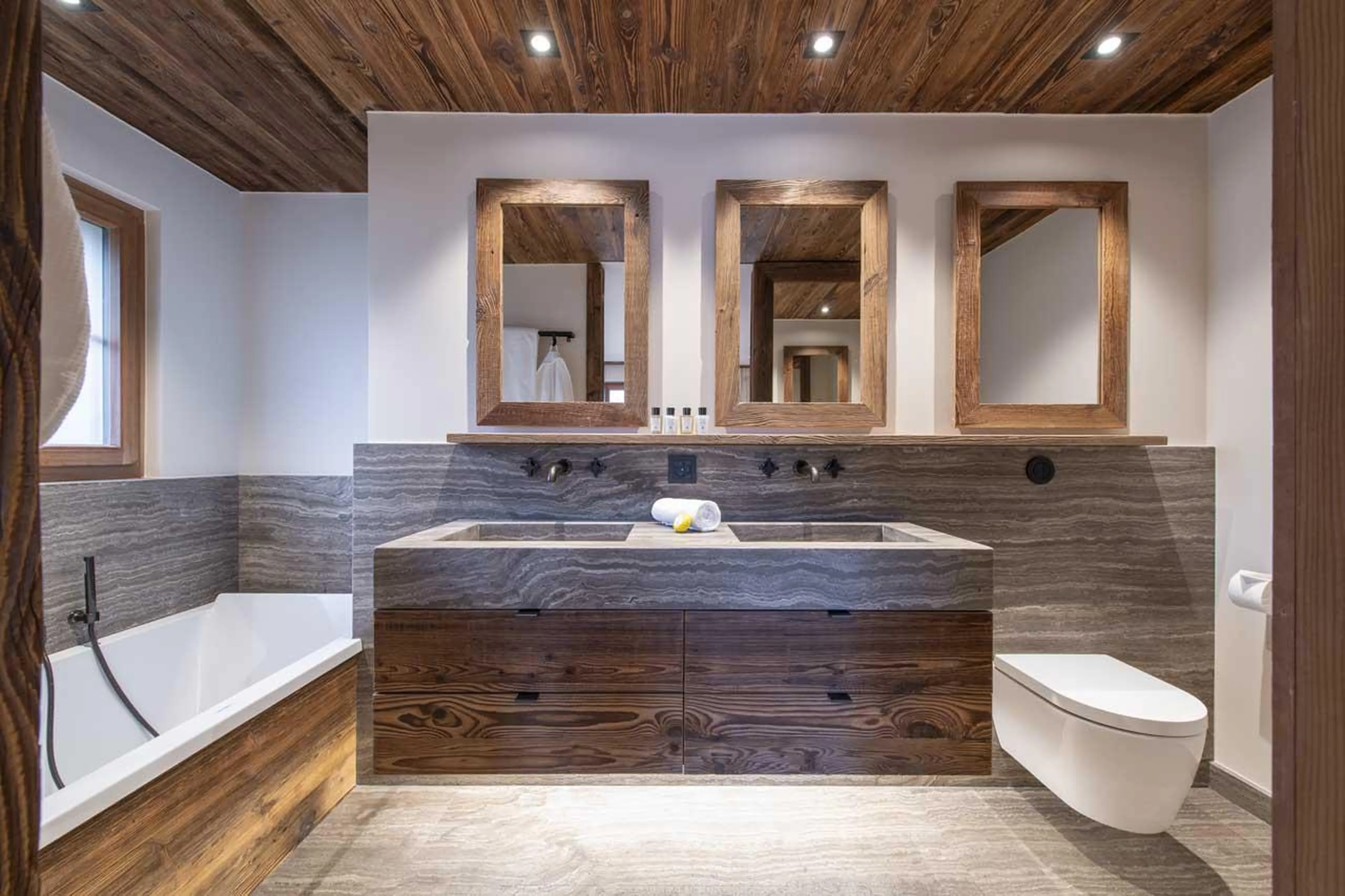 En-suite bathroom with double basin at Apartment Lussy in Verbier