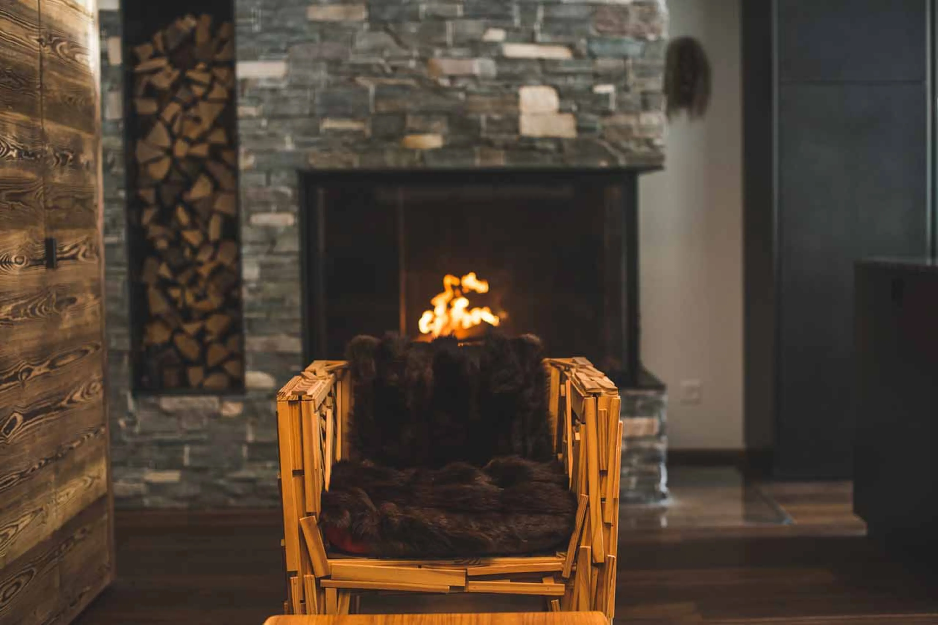 Armchair by the fire at Apartment Lys in Zermatt