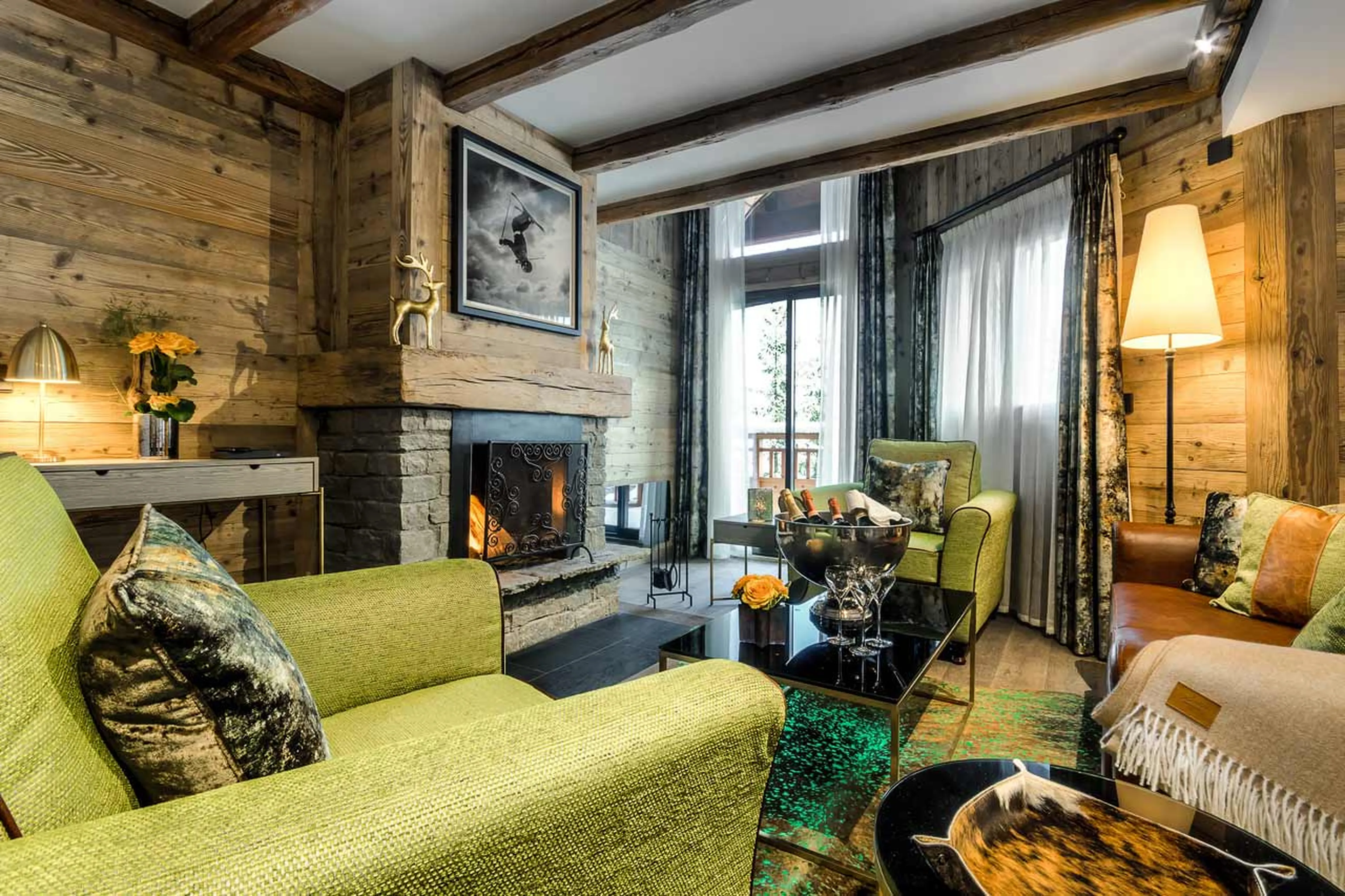 Stone fireplace in lounge of Apartment No 200 in Courchevel 1850