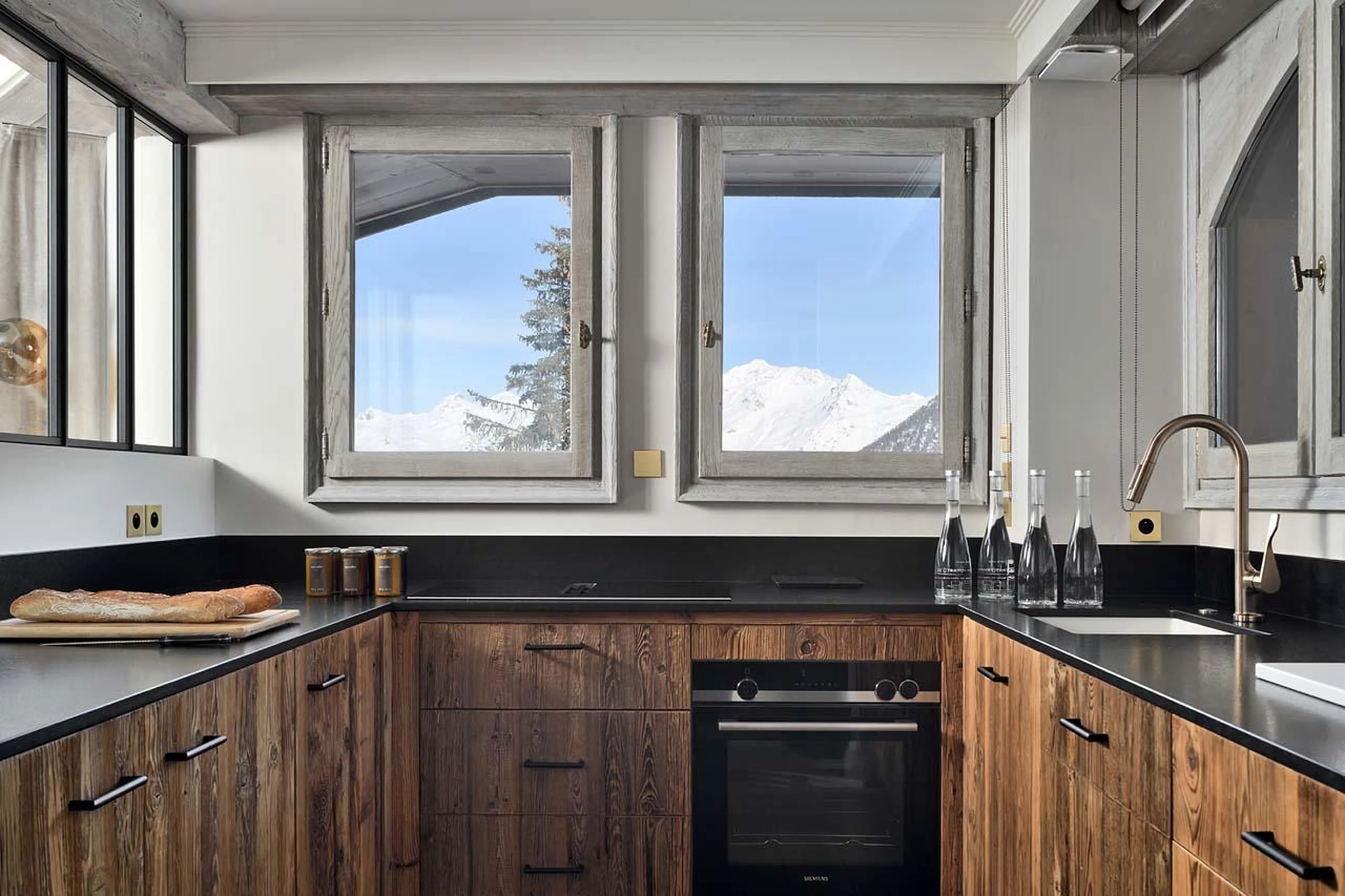 Modern kitchen with spectacular views over the mountains at Apartment Pyramides in Courchevel 1850