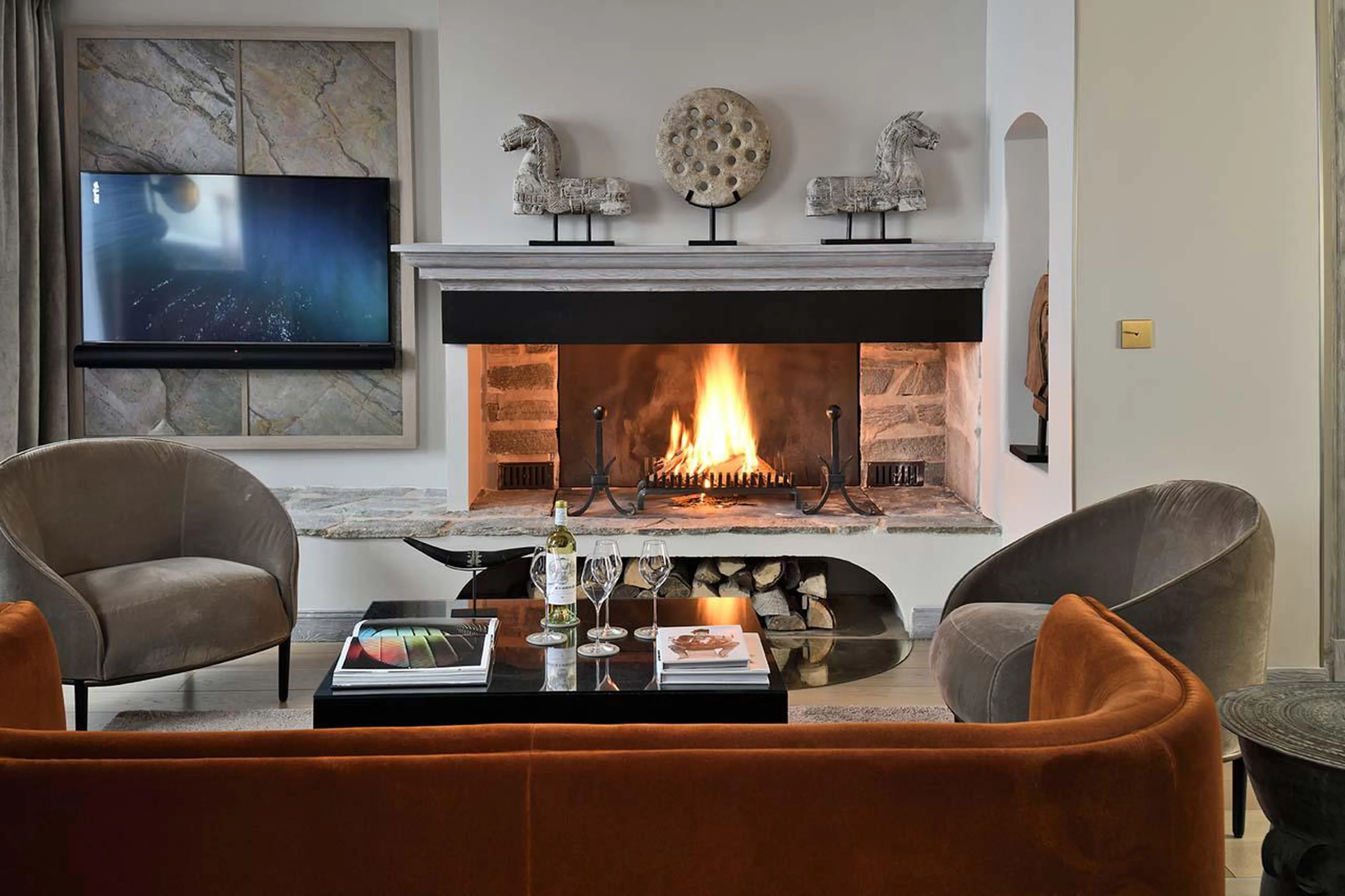Open-plan living room with ethanol fireplace at Apartment Roc-Merlet in Courchevel 1850