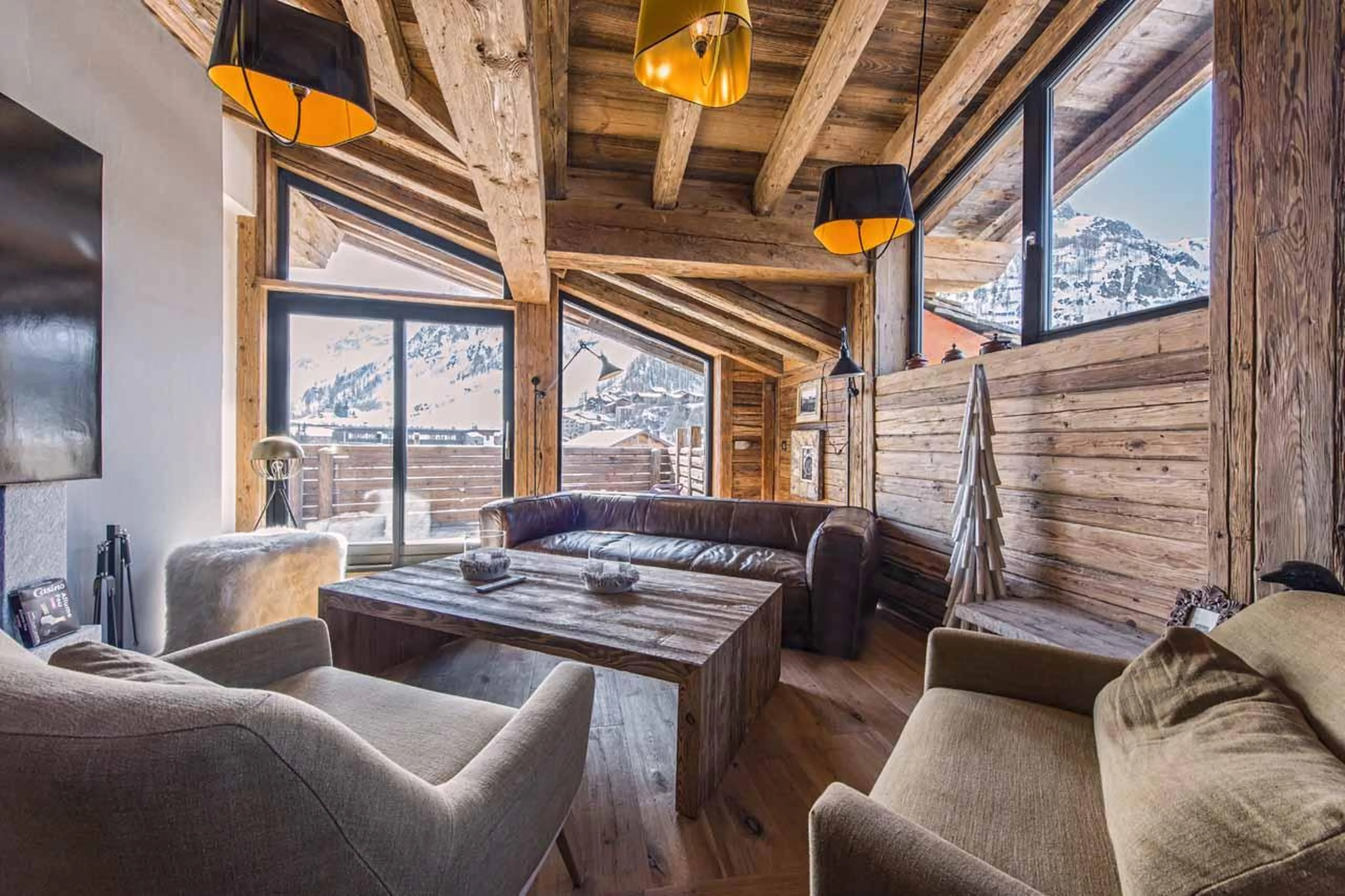 Comfortable sofas and balcony access in Le Penthouse Savoie, Val d'Isere