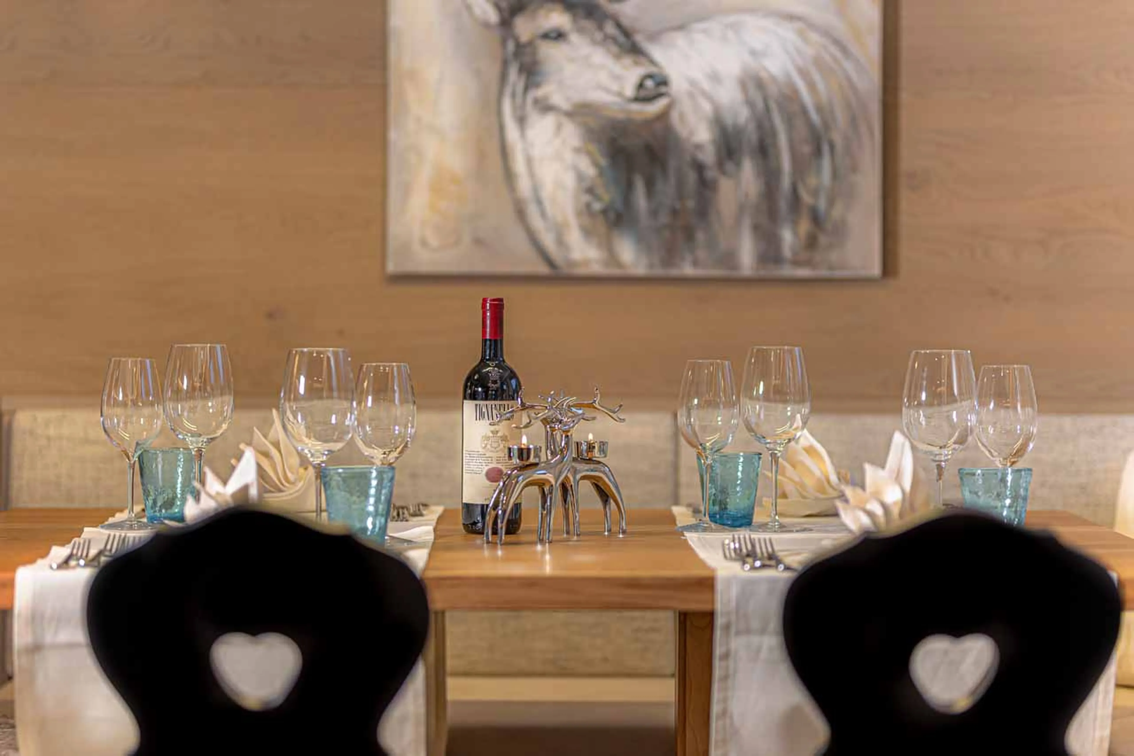 Dining table with wine at Apartment Selva in Val Gardena