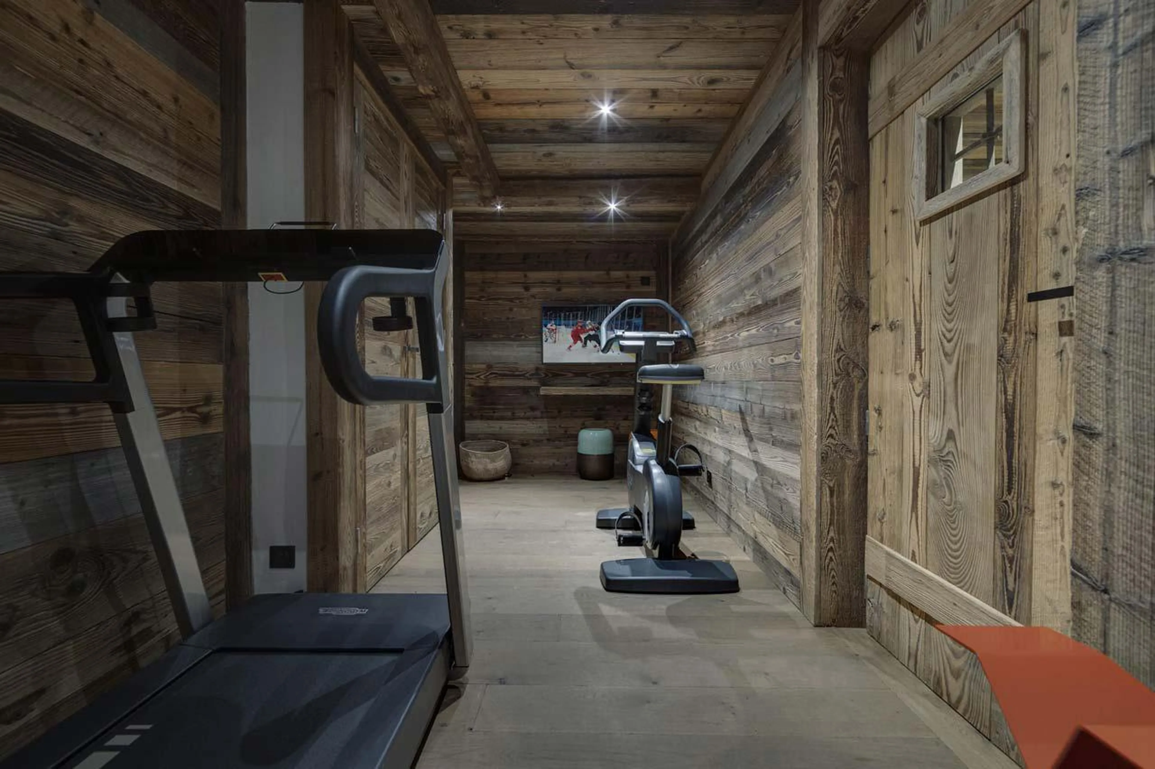 Fitness room with Technogym treadmill and bike at Apartment Snowy Breeze in Val d'Isere