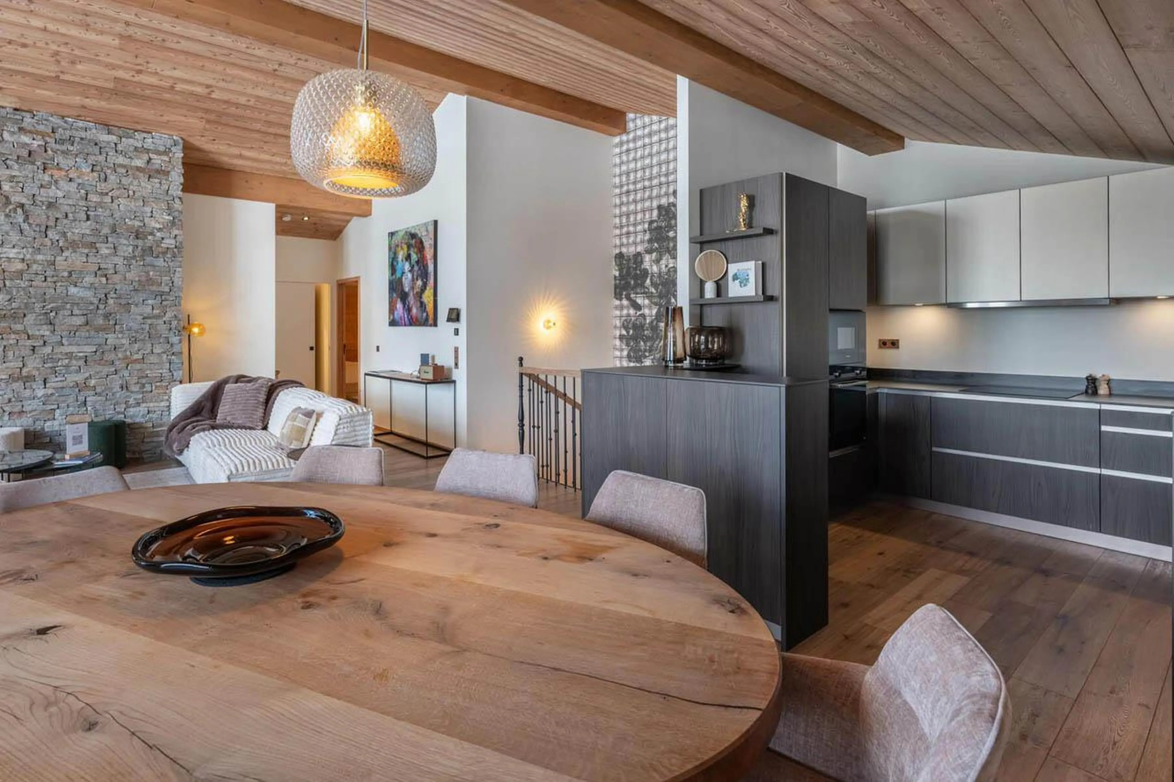 Dining table and kitchen area at Apartment Tintoretto in Courchevel 1850