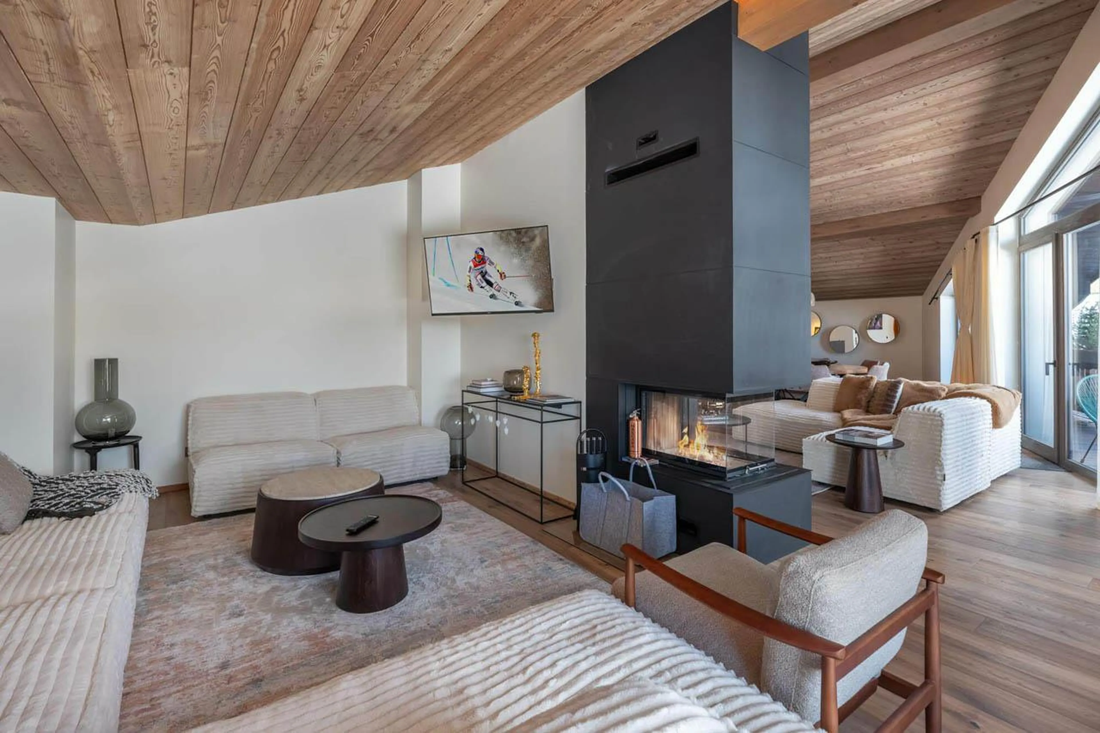 Cosy sofa area with fireplace at Apartment Tintoretto in Courchevel 1850