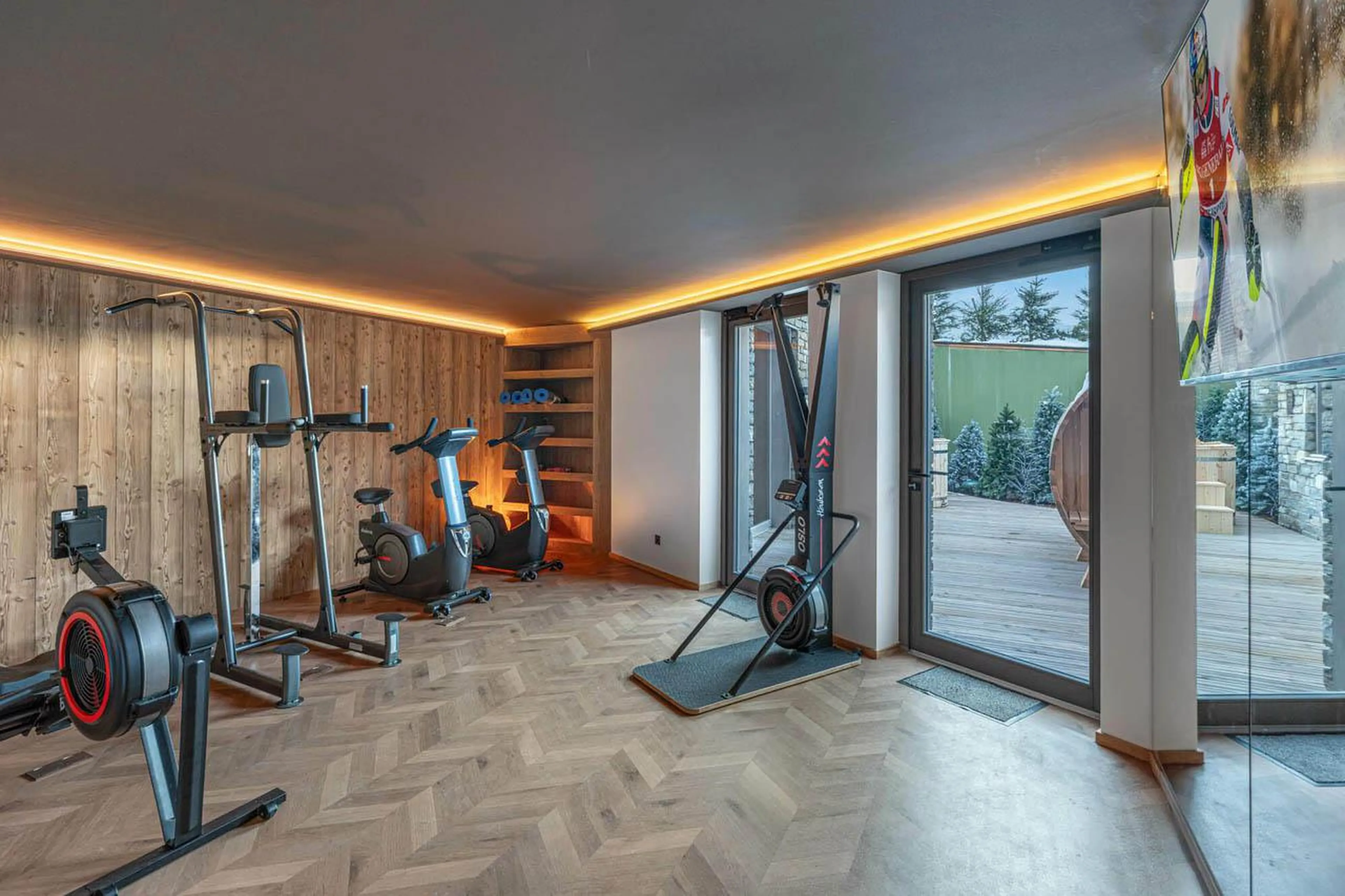 Modern gym with terrace access at Apartment Tintoretto in Courchevel 1850