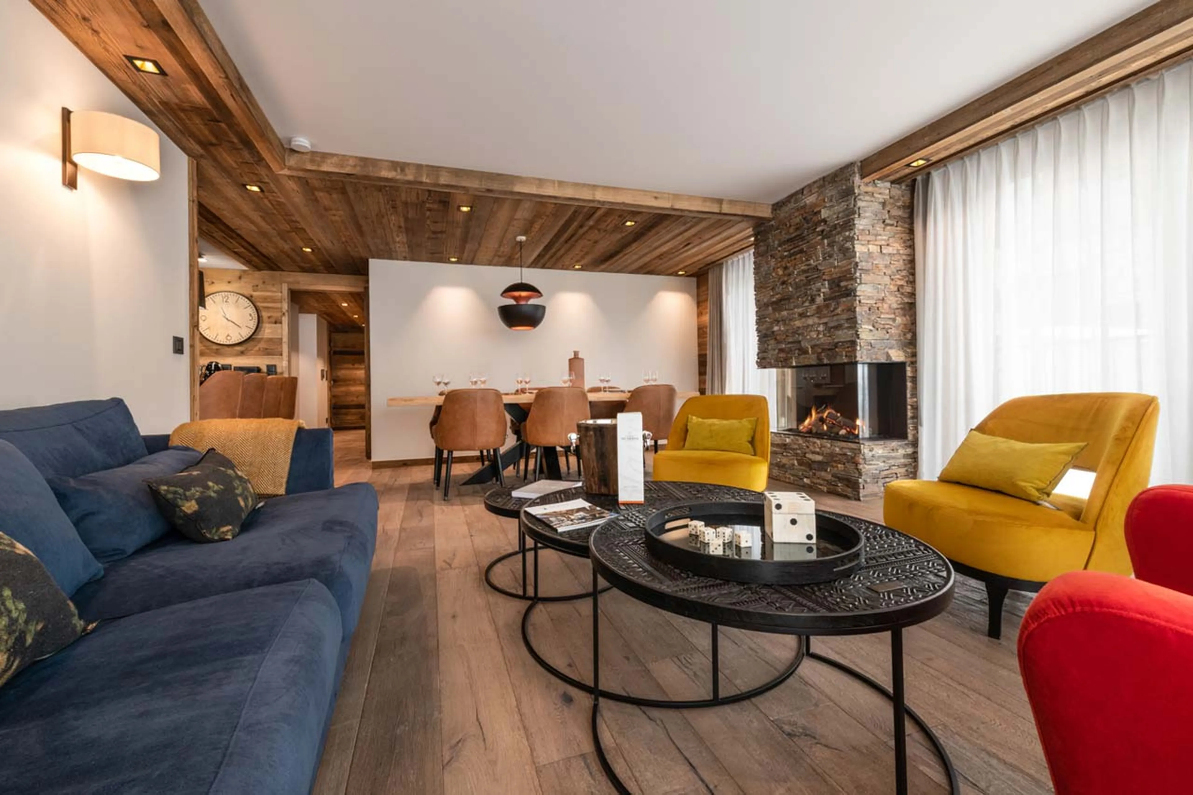 Living area with central fireplace at Apartment Vail Lodge A22 in Val d'Isere