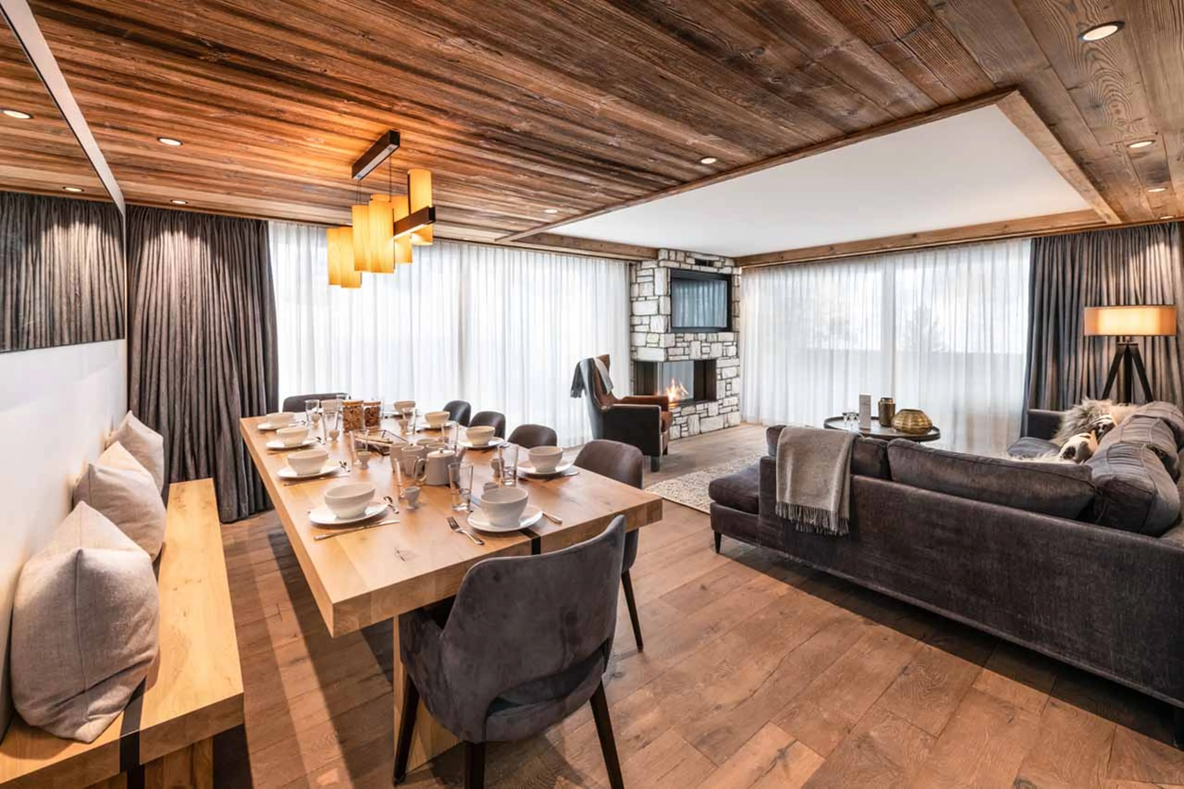 Dining area overlooking living room at Vail Lodge Apartment B12, Val d'Isere
