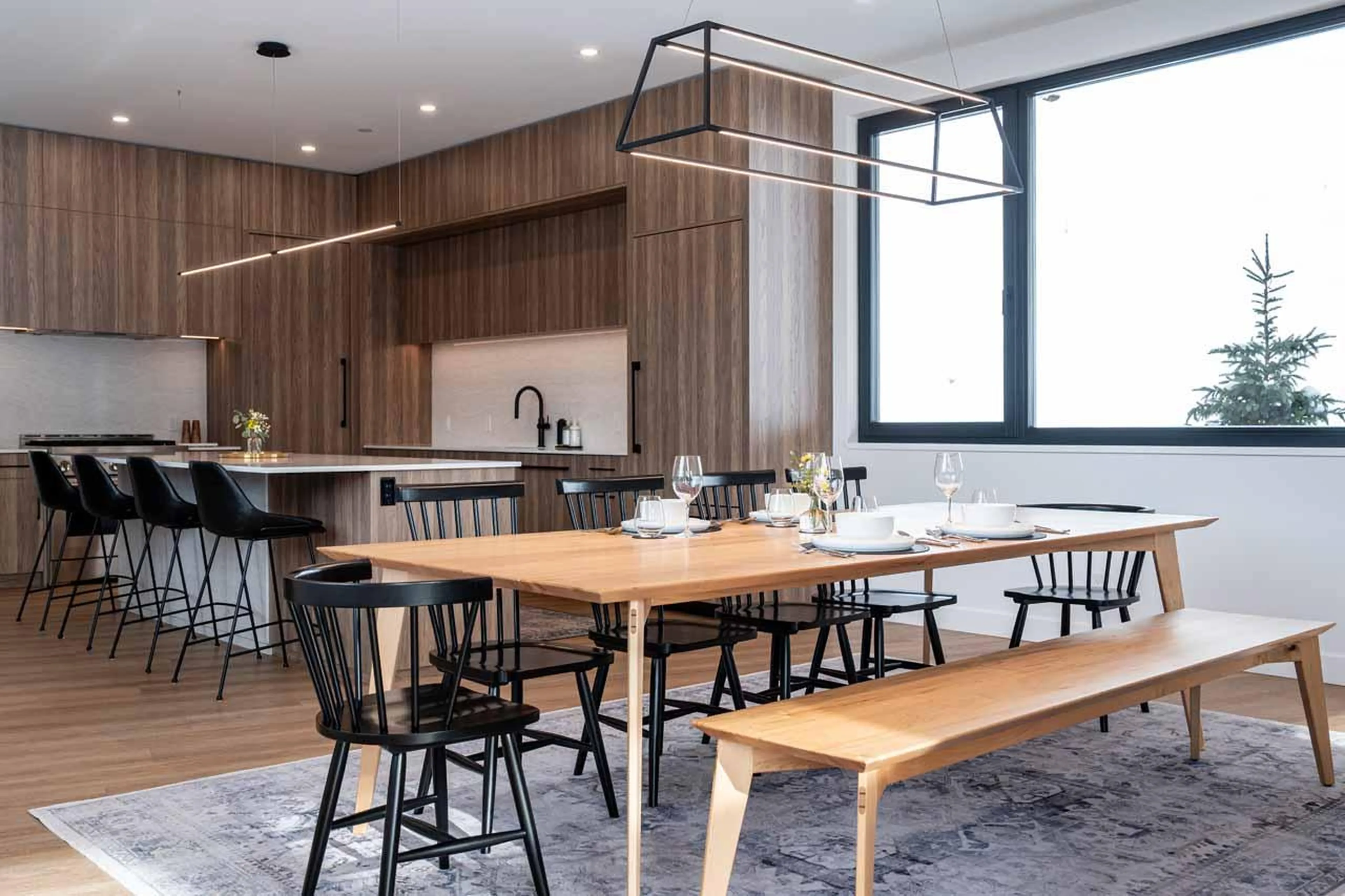 Living space with expansive windows at Arrowhead Lodge in Revelstoke