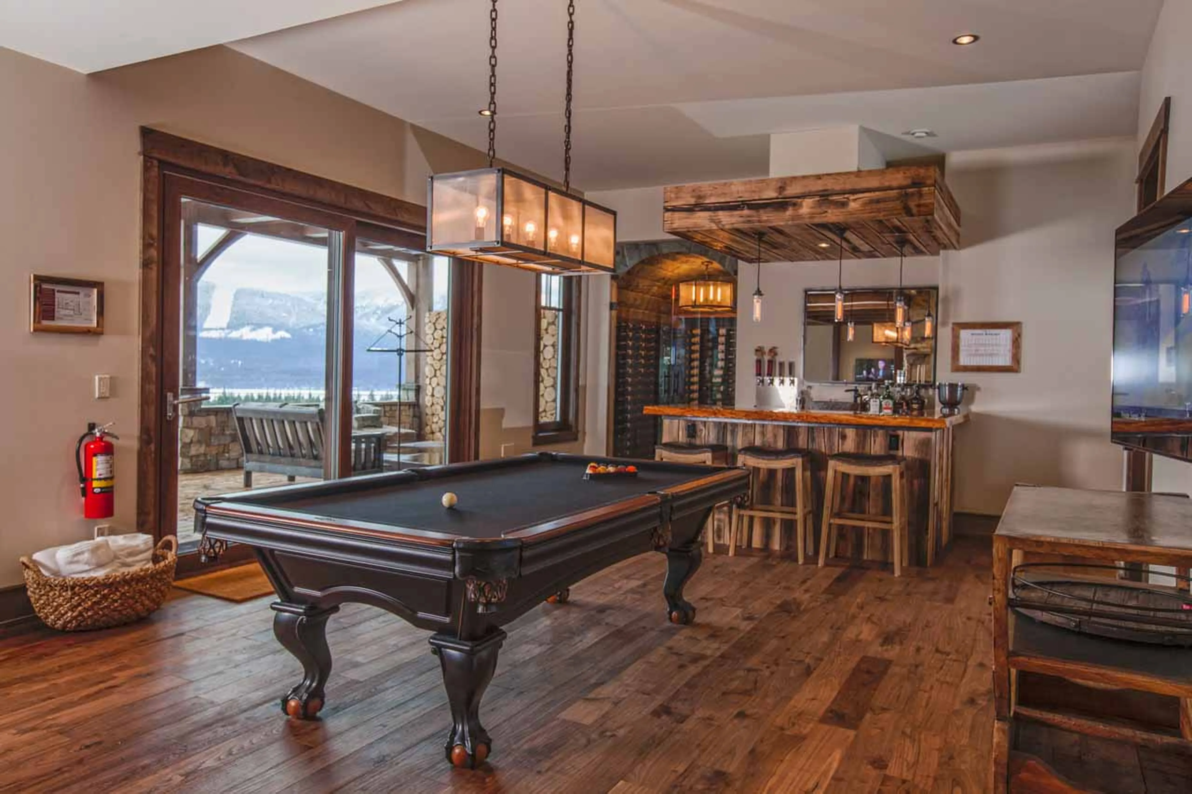 Pool table and bar at Bison Lodge in Revelstoke