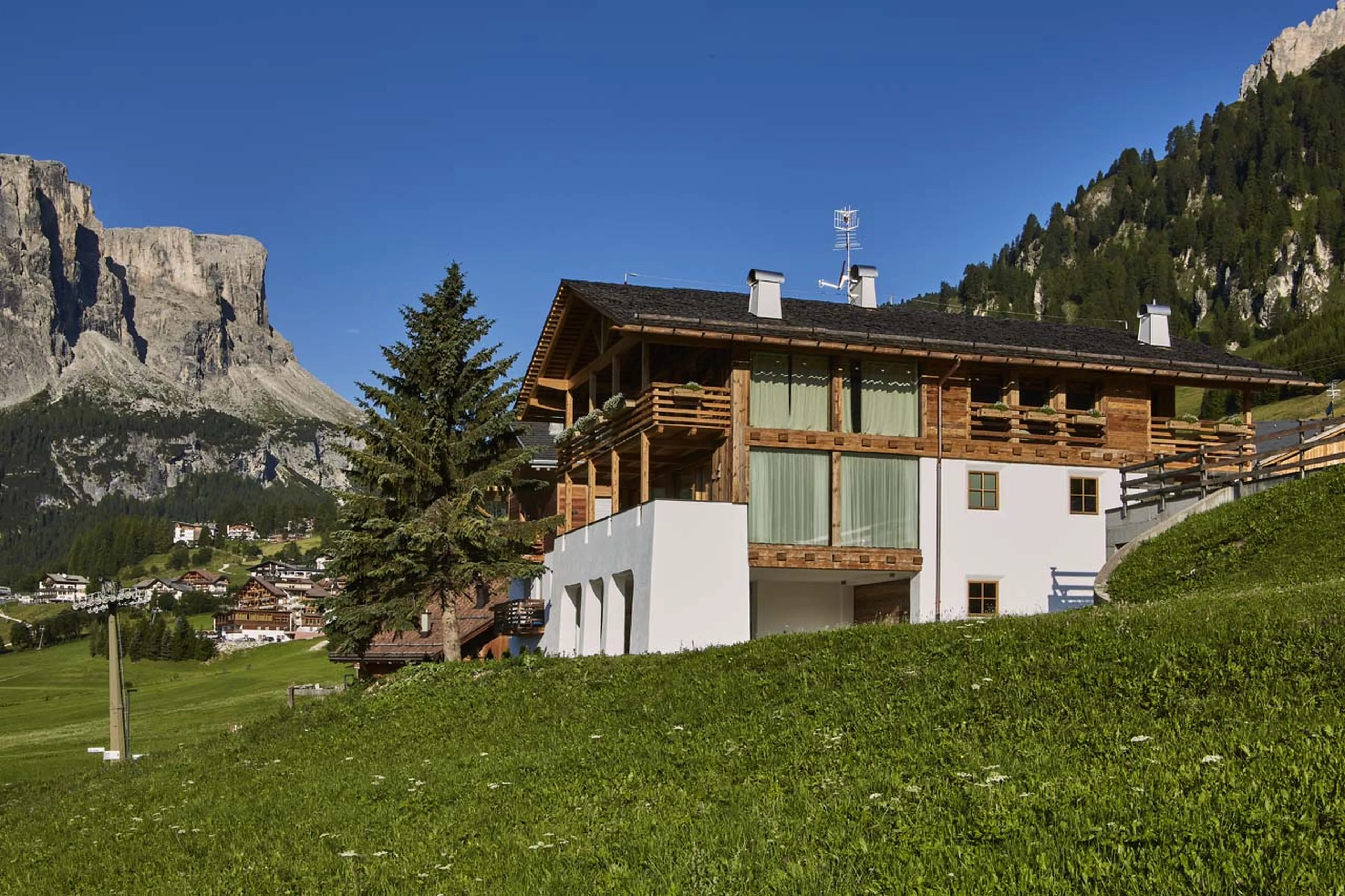 Exterior of Casa Feroze in Alta Badia in summer