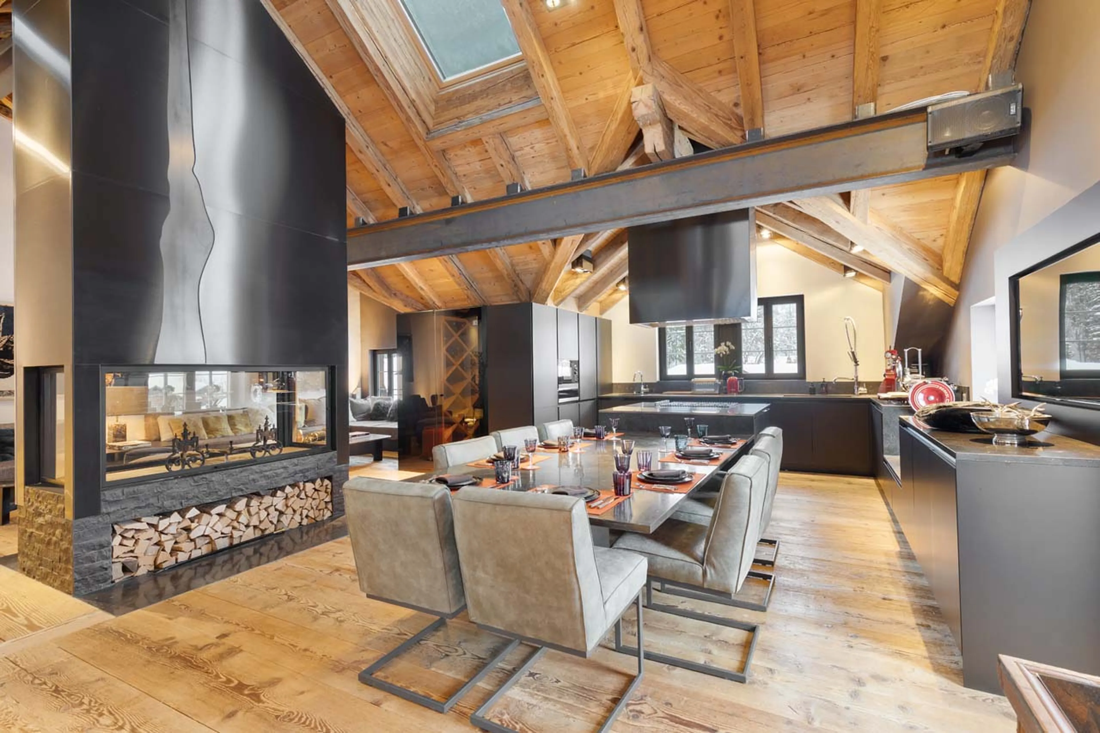 Open-plan living and dining area at Casa Promenade in Gstaad